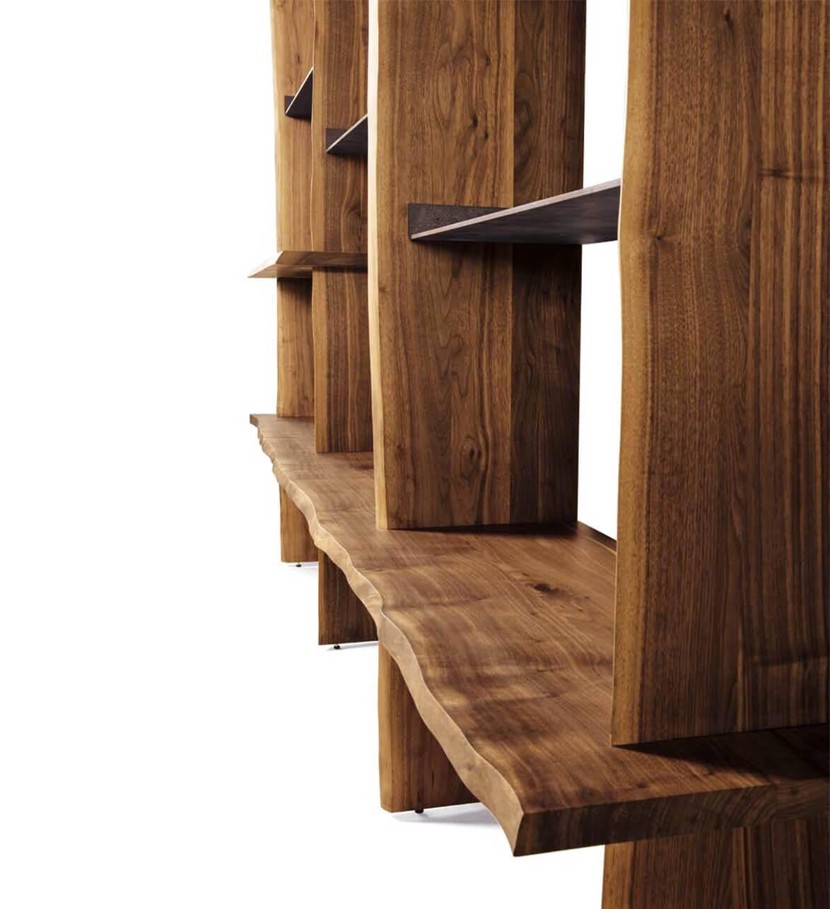 Capanna is a wall bookcase equipped with shelves and support floors and made of precious canaletto walnut finished with acrylic. The Italian artisan tradition is reinterpreted in a contemporary design to create a refined piece of wooden furniture.