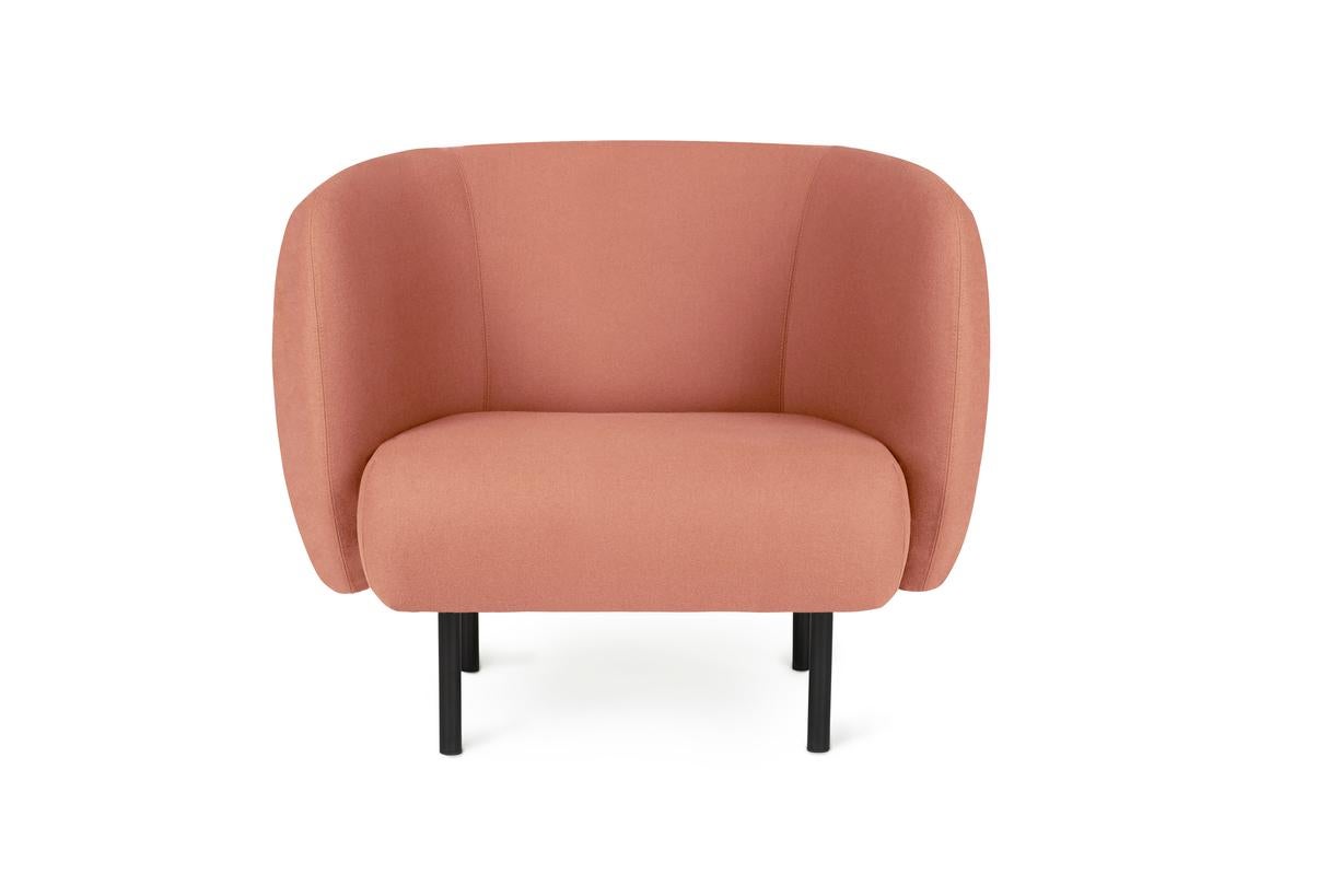 Cape lounge chair blush by Warm Nordic
Dimensions: D 90 x W 82 x H 80 cm
Material: Textile upholstery, Wooden frame, Powder coated black steel legs
Weight: 34.5 kg
Also available in different colours and finishes.

An elegant armchair with an