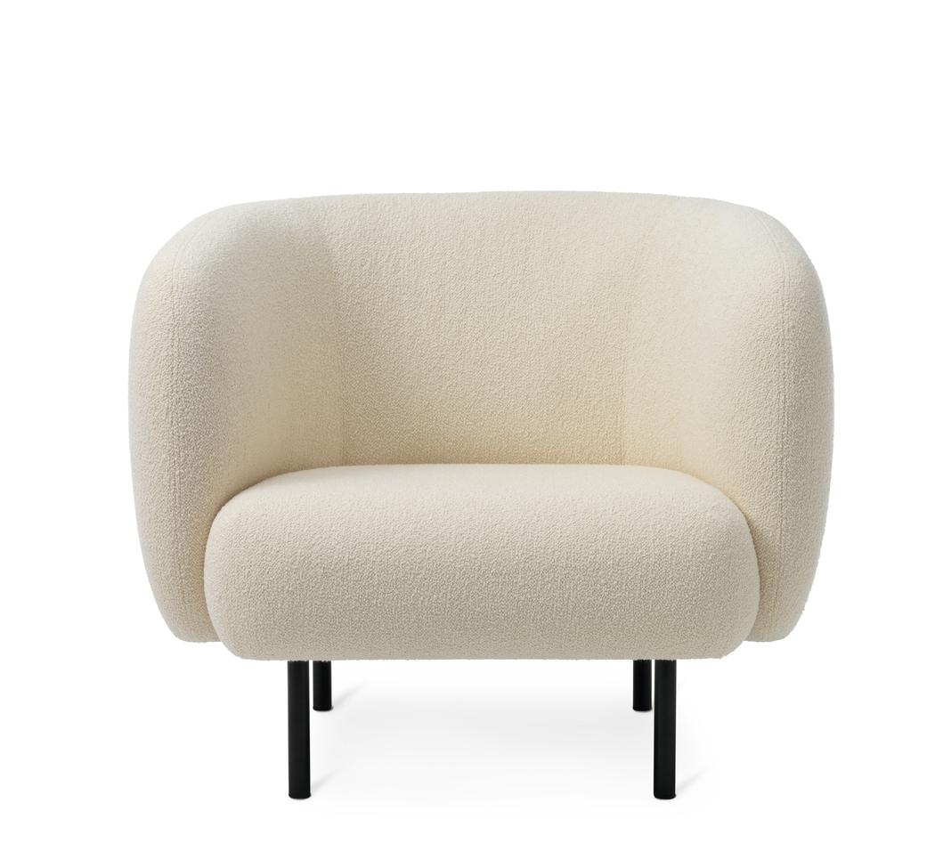 Cape lounge chair cream by Warm Nordic
Dimensions: D 90 x W 82 x H 80 cm
Material: Textile upholstery, Wooden frame, Powder coated black steel legs
Weight: 34.5 kg
Also available in different colours and finishes.

An elegant armchair with an