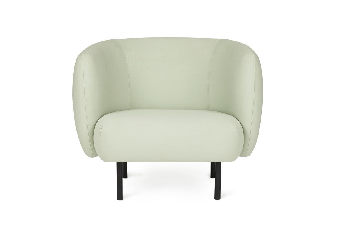 Cape lounge chair mint by Warm Nordic
Dimensions: D90 x W82 x H 80 cm.
Material: textile upholstery, wooden frame, powder coated black steel legs
Weight: 34.5 kg.
Also available in different colours and finishes. 

An elegant armchair with an