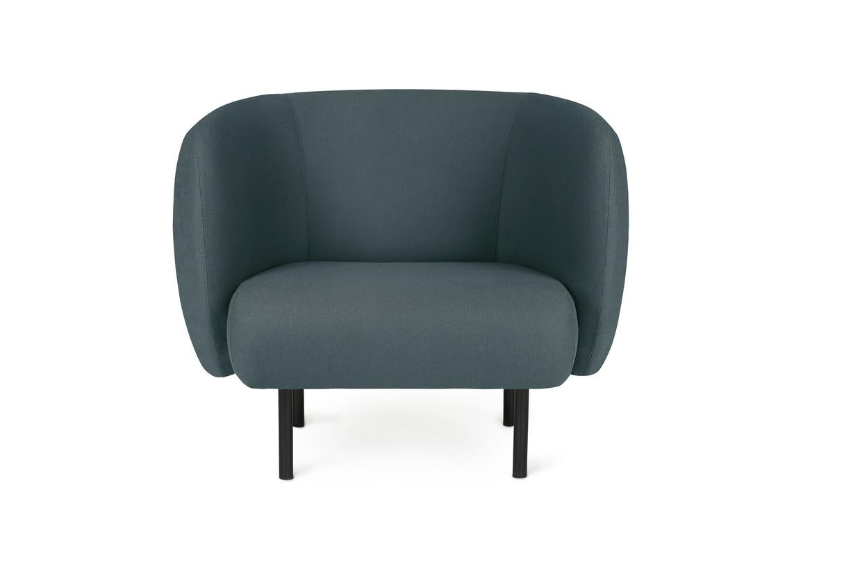 Cape Lounge chair Petrol by Warm Nordic
Dimensions: D90 x W82 x H 80 cm
Material: Textile upholstery, Wooden frame, Powder coated black steel legs
Weight: 34.5 kg
Also available in different colours and finishes.

An elegant armchair with an