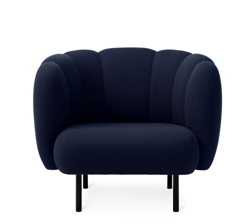 Cape Lounge chair with stitches steel blue by Warm Nordic
Dimensions: D95 x W84 x H 80 cm
Material: Textile upholstery, Wooden frame, Powder coated black steel legs
Weight: 36.5 kg
Also available in different colours and finishes. 

An elegant