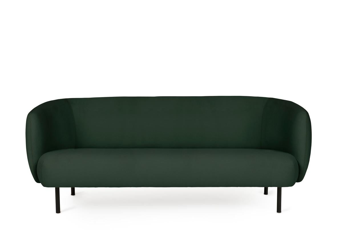 Caper 3 seater forest green by Warm Nordic
Dimensions: D206 x W84 x H 63 cm
Material: textile upholstery, wooden frame, powder coated black steel legs.
Weight: 55.5 kg
Also available in different colours and finishes.

An elegant sofa with an