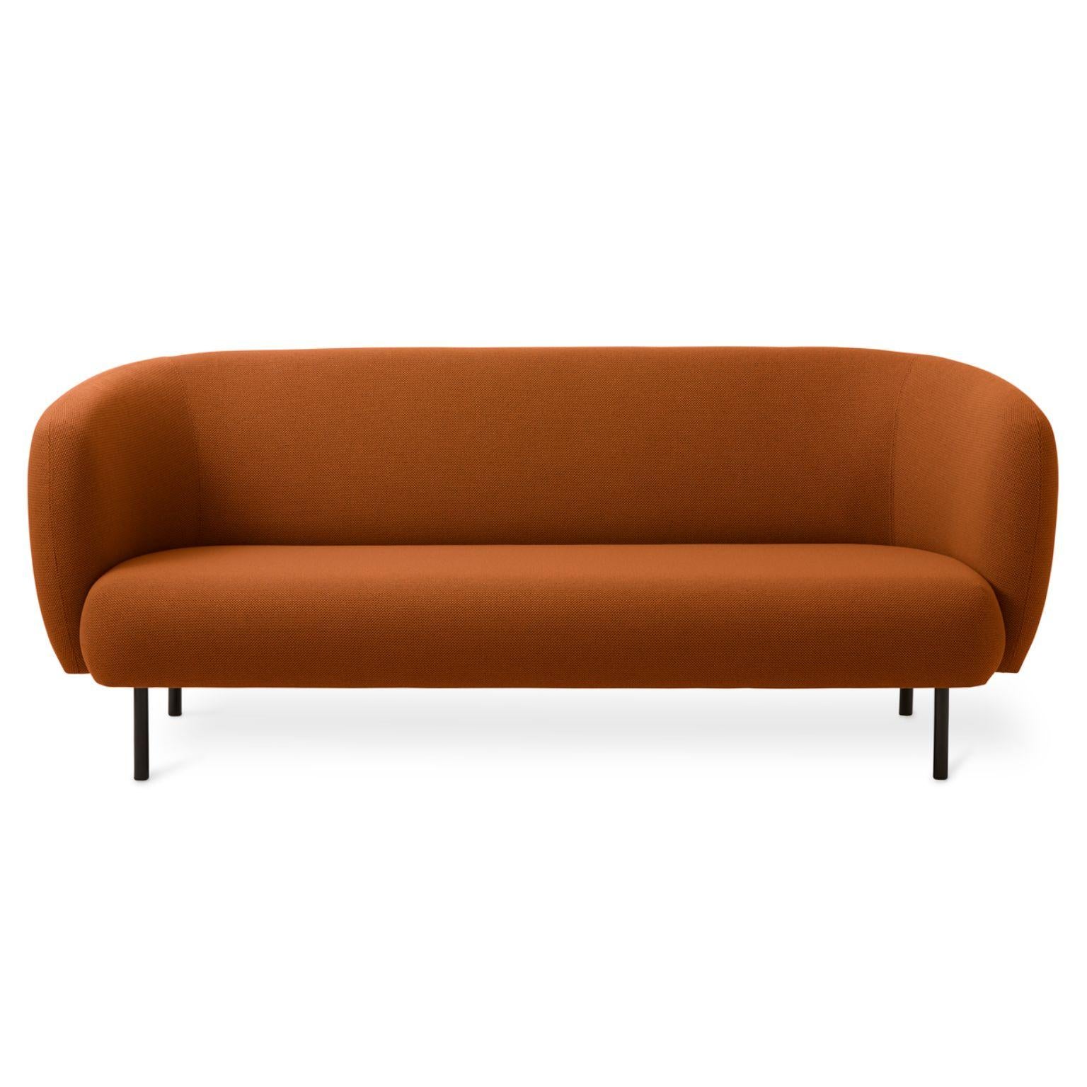 Caper 3 seater terracotta by Warm Nordic
Dimensions: D206 x W84 x H 63 cm
Material: Textile upholstery, Wooden frame, Powder coated black steel legs.
Weight: 55.5 kg
Also available in different colours and finishes. 

An elegant sofa with an