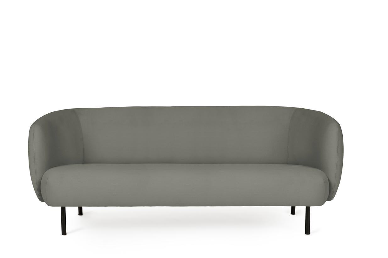 Caper 3 seater warm grey by Warm Nordic
Dimensions: D 206 x W 84 x H 63 cm
Material: Textile upholstery, Wooden frame, Powder coated black steel legs.
Weight: 55.5 kg
Also available in different colours and finishes.

An elegant sofa with an