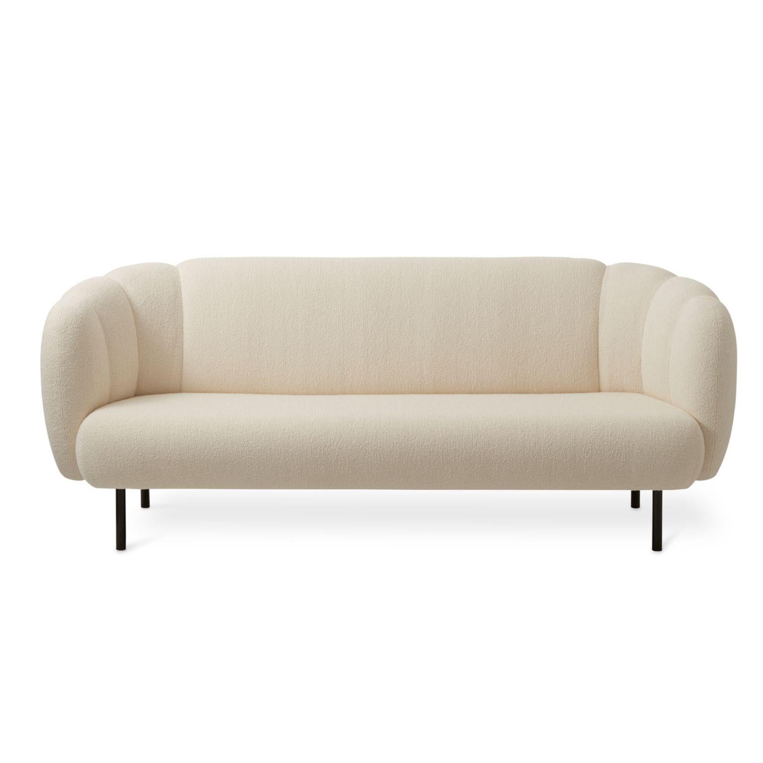 Caper 3 seater with stitches cream by Warm Nordic.
Dimensions: D200 x W84 x H 80 cm.
Material: textile upholstery, wooden frame, powder coated black steel legs.
Weight: 55.5 kg
Also available in different colours and finishes. 

An elegant