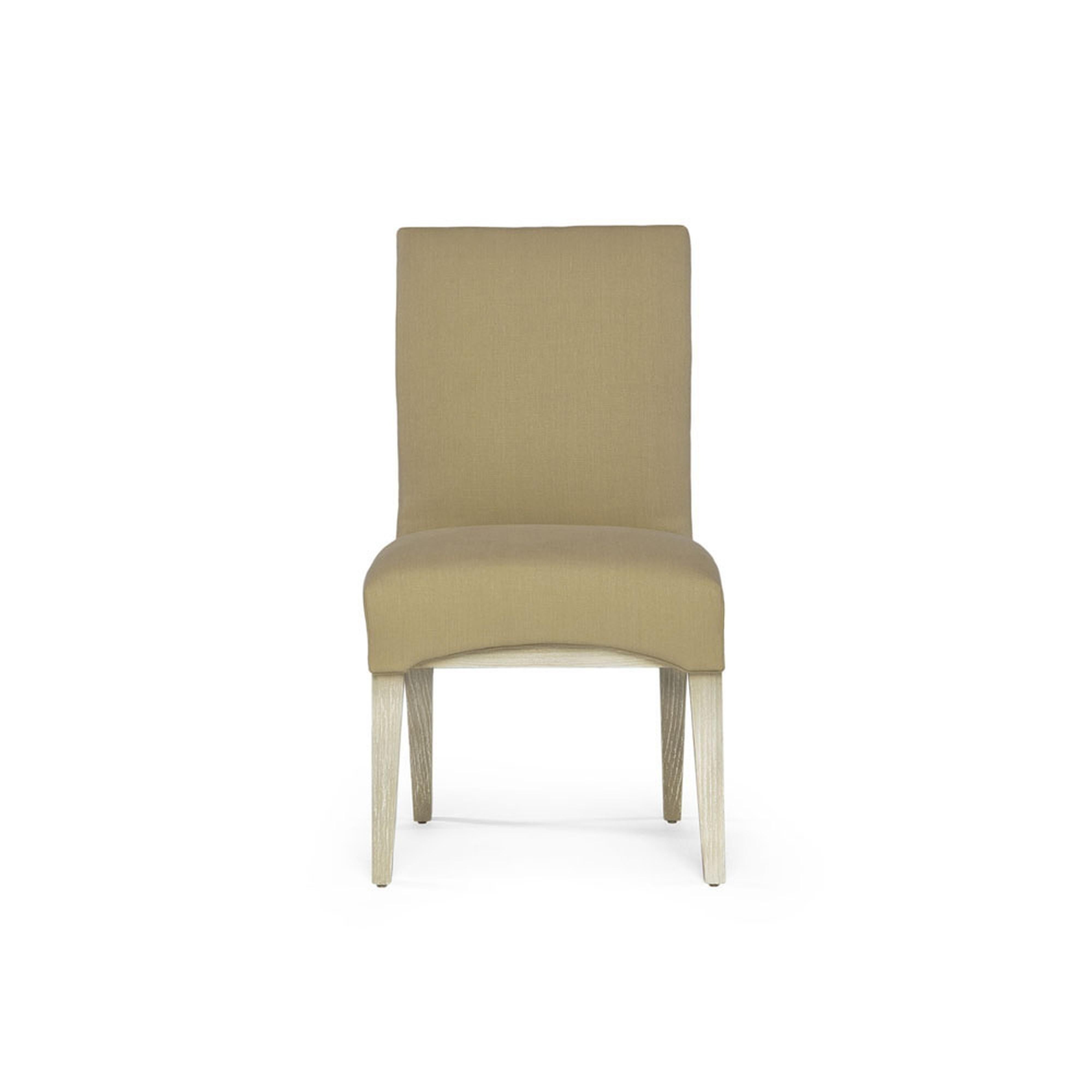 Complementary to the Capistrano dining table, the dining side chair evokes the charm of Spanish in uence of the Southern Californian 1900s. The chair is newly upholstered in the front, with a cushioned seat. The back of the chair features a