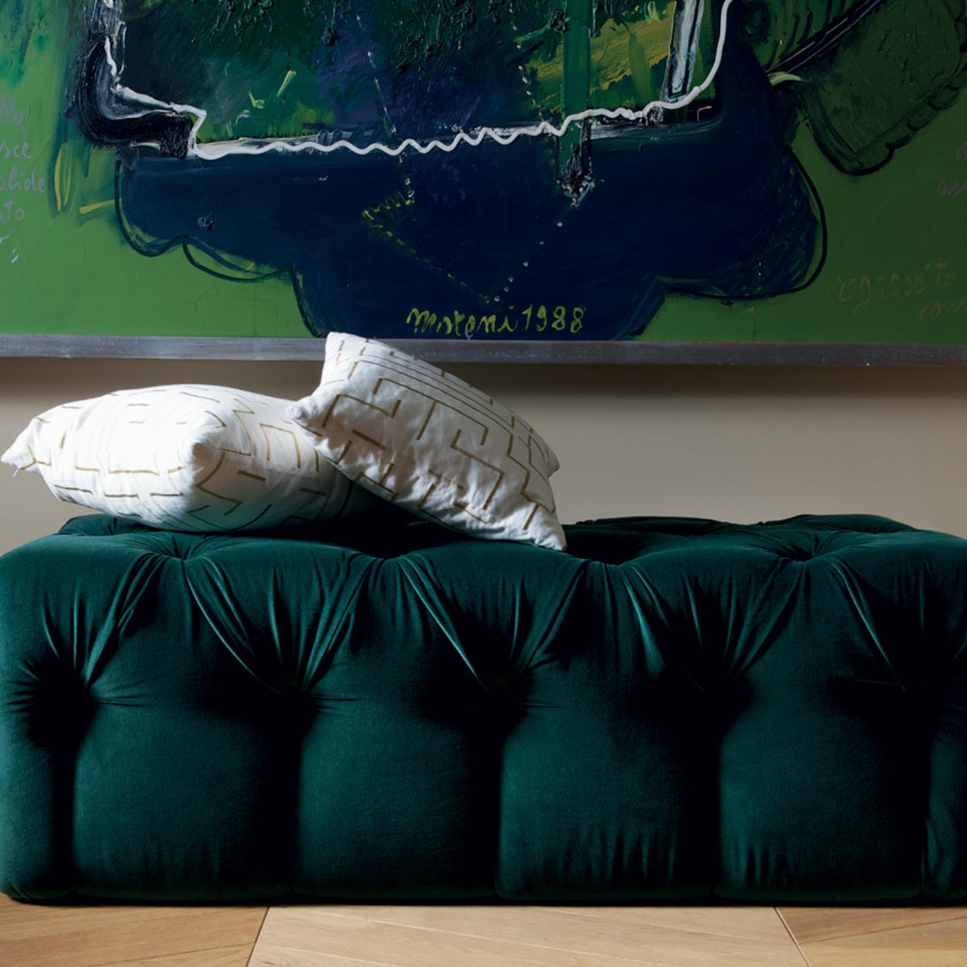 Entirely detailed by hand using the capitonne' technique, this sophisticated pouf boasts exquisite, tufted details on the hunter-green velvet upholstery that add classic elegance to the simple, rectangular frame. Either as a plush, comfortable seat,