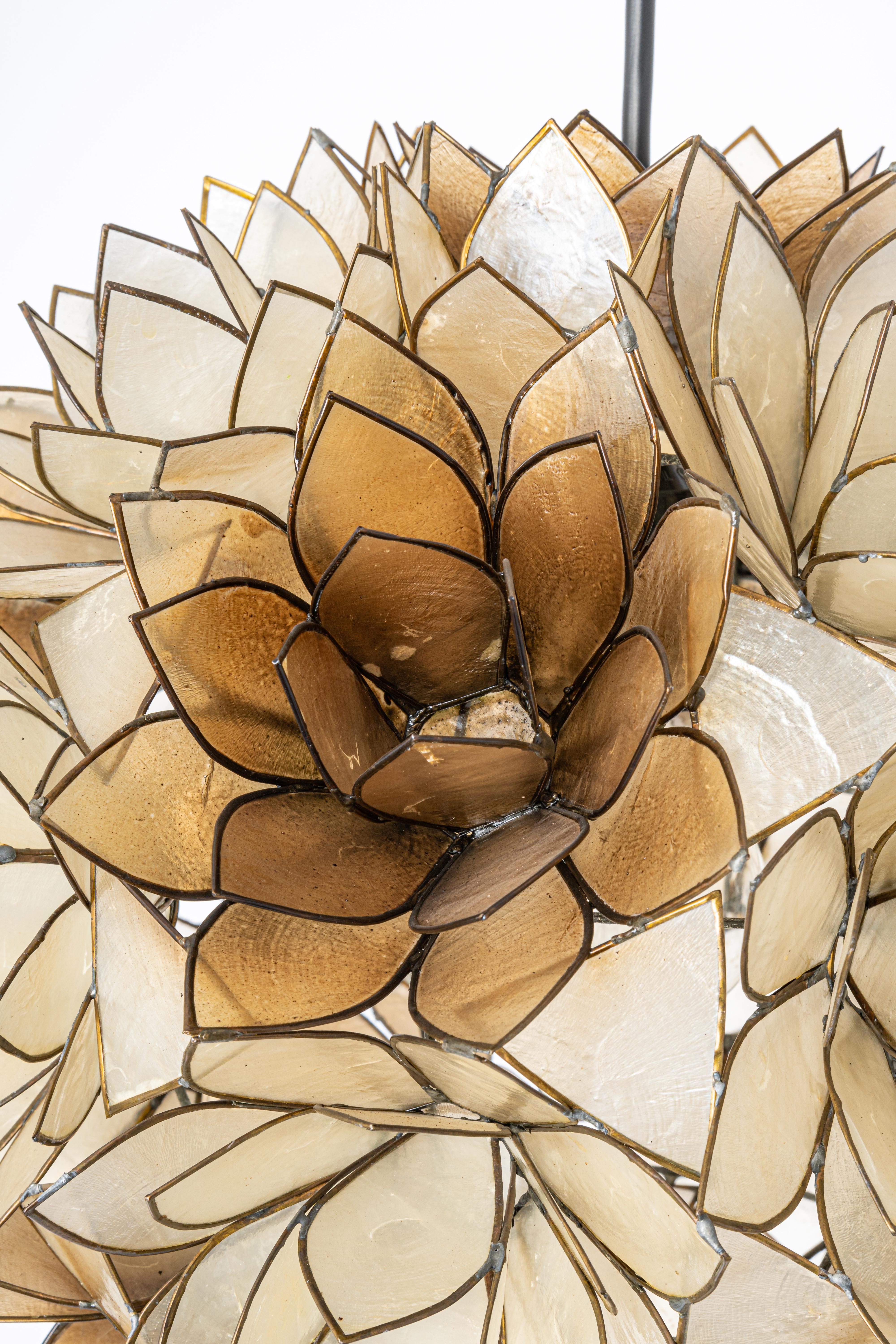 Stunning Capiz shell Lotus ball chandelier pendant light Germany, 1960s

It requires 1 x E27 standard bulbs with 100W max each.
A light bulb is not included. It is possible to install this fixture in all countries (US, UK, Europe, Asia,