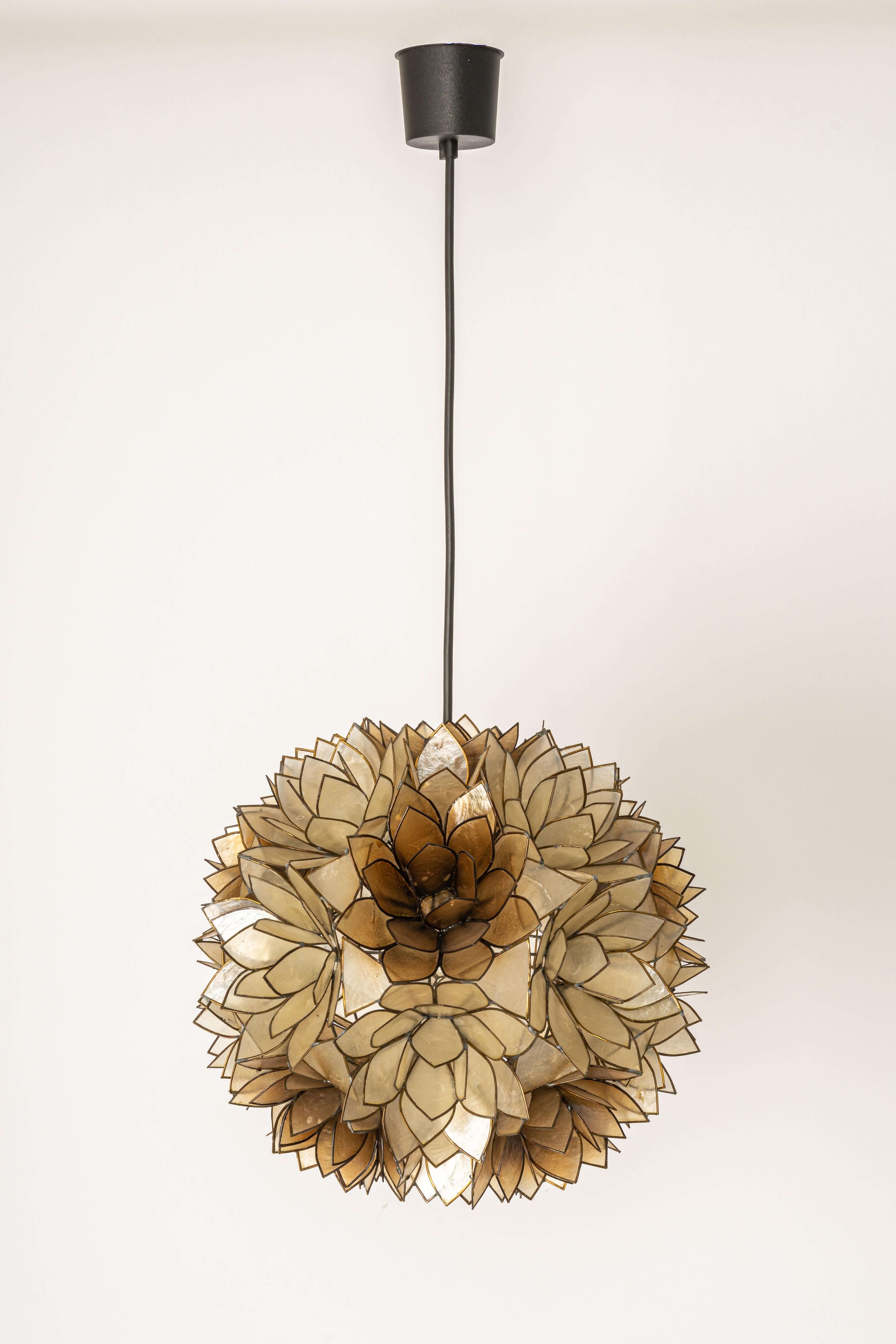 Stunning Capiz shell Lotus ball chandelier pendant light Germany, 1960s

It requires 1 x E27 standard bulbs with 100W max each.
A light bulb is not included. It is possible to install this fixture in all countries (US, UK, Europe, Asia,