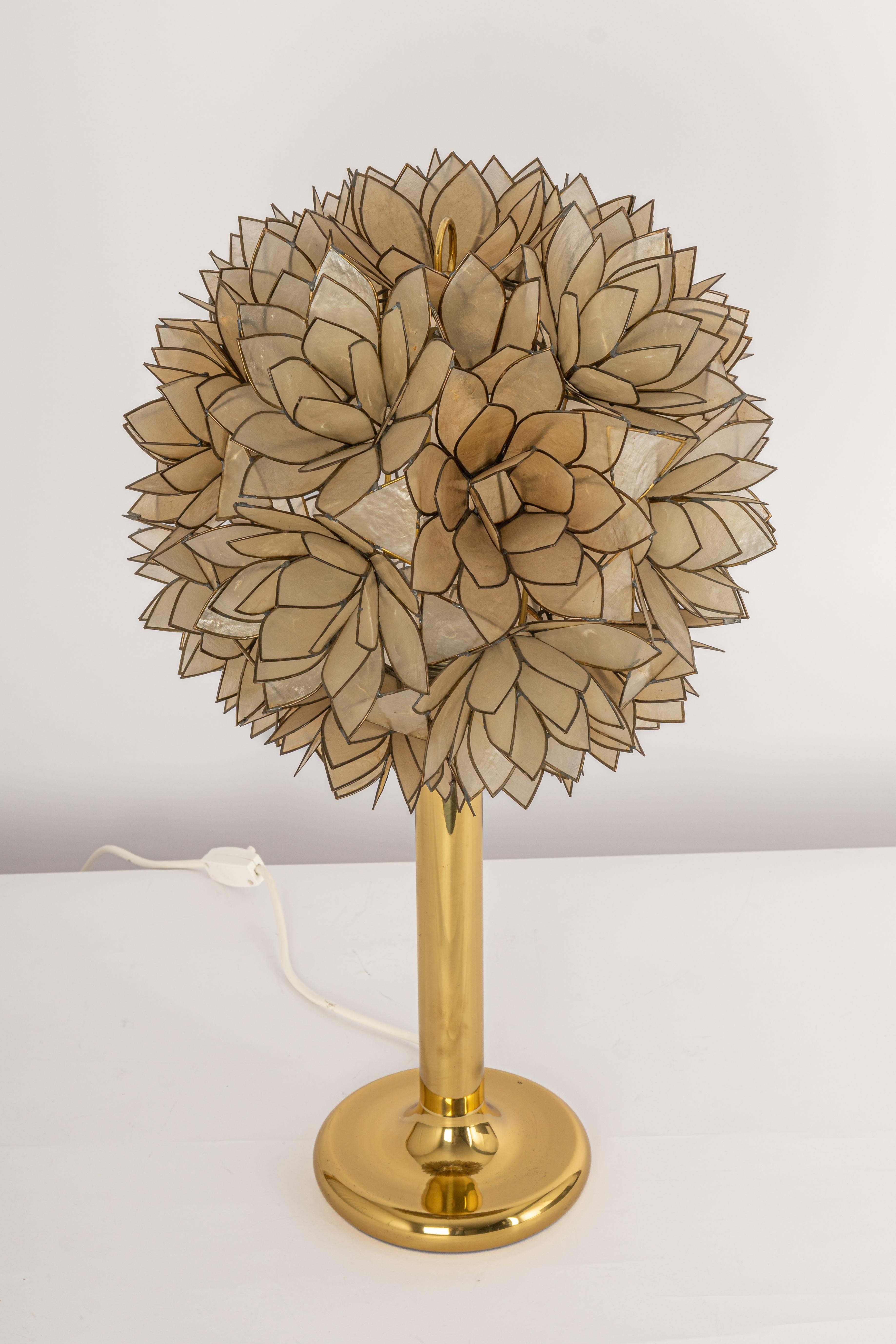 Stunning Capiz shell Lotus ball table light Germany, 1960s

It requires 1 x E27 standard bulbs with 100W max each.
A light bulb is not included. It is possible to install this fixture in all countries (US, UK, Europe, Asia, Australia,..)
Very