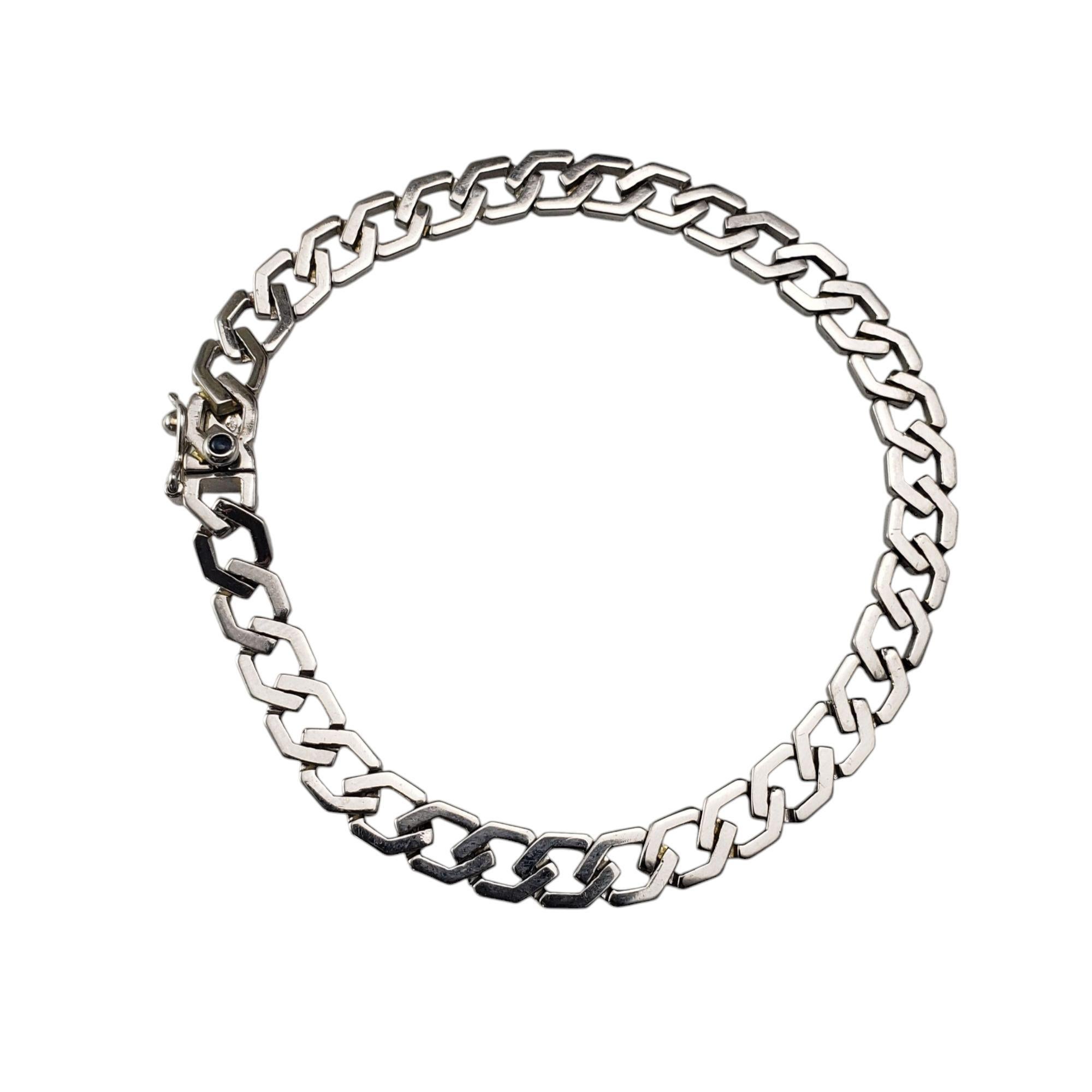 Caplain St. Andre France 18K White Gold Link Bracelet-

This elegant bracelet is a testament to French elegance and craftsmanship. This timeless piece features interlocking links crafted in 18K white gold, offering a sleek and sophisticated
