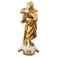 Statuette en céramique dorée Capodimonte ''Capricorne''.