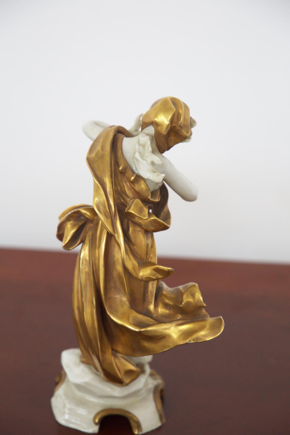 A beautiful ceramic figurine, part of the 'Signs of the Zodiac' collection, made in the early 20th century from Capodimonte ceramic painted in gold.
Capodimonte is a type of Italian porcelain first developed in the 18th century. It is known for its