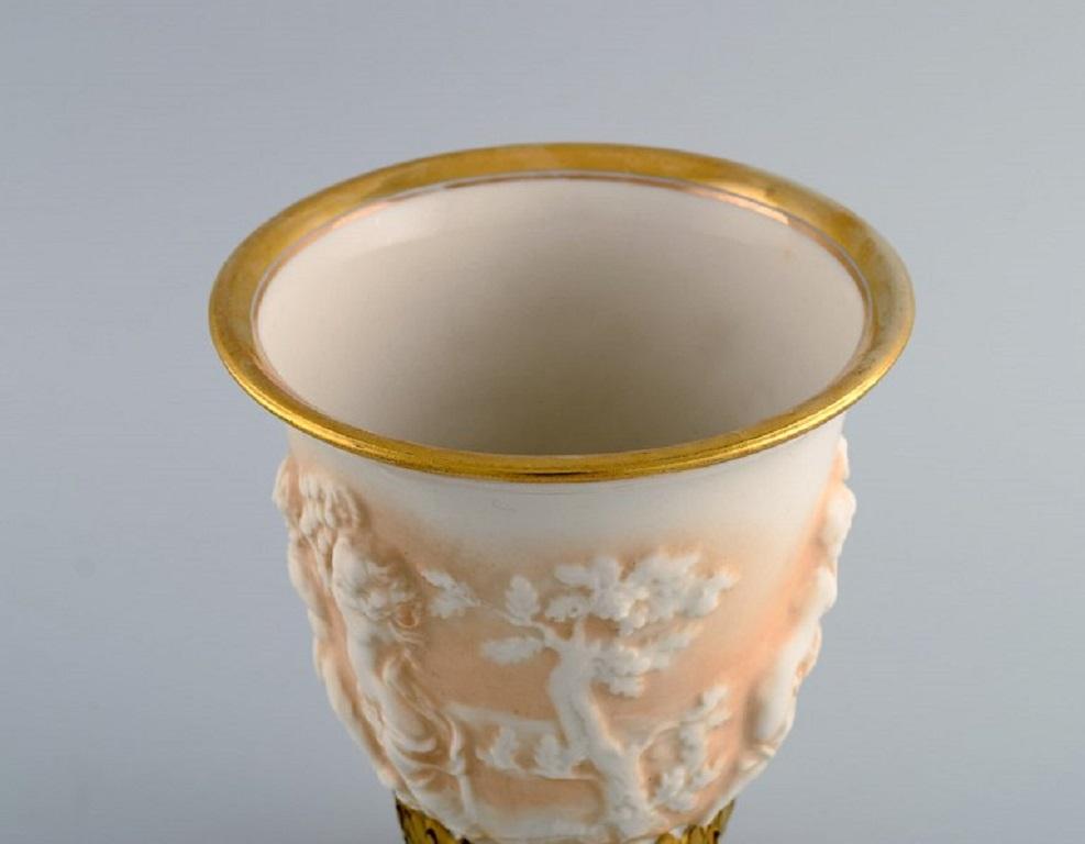 Porcelain Capodimonte, Italy. Antique porcelain vase with putti in relief. Early 20th C. For Sale
