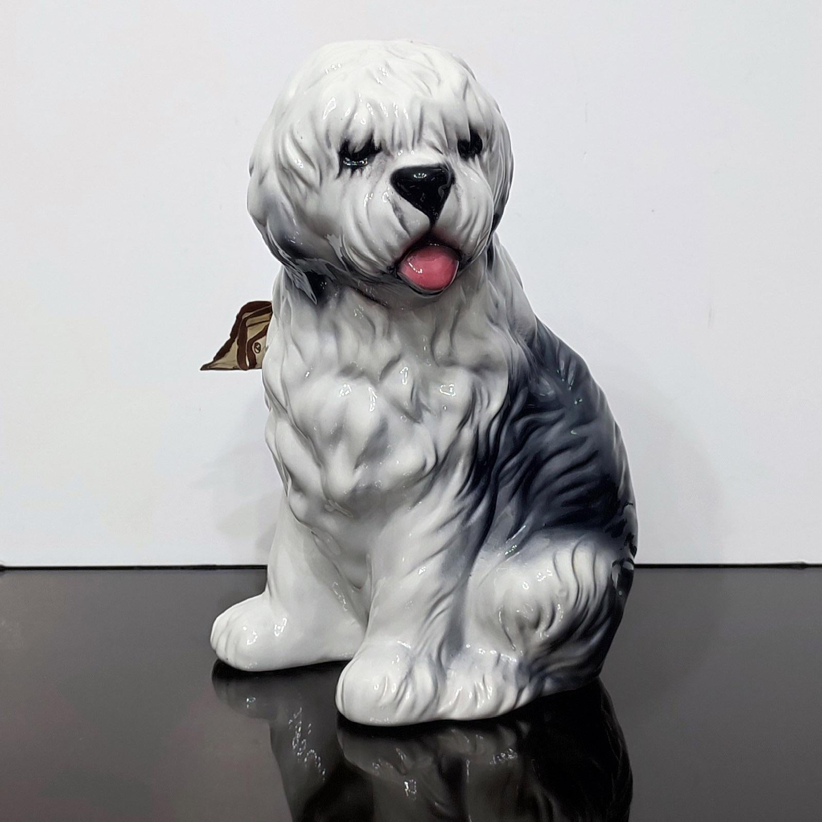 Beautiful, old English sheepdog hand-painted porcelain figurine made by Capodimonte, Italy.
Handmade and hand painted.
Original manufacturer label/certificate.
Measure: 30 cm (18,9 in) high.
Very good condition, as new.