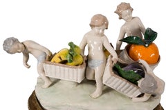 Capodimonte porcelain centerpiece, children with fruit baskets
