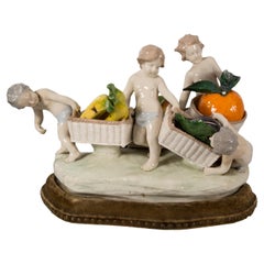 Capodimonte porcelain centerpiece, children with fruit baskets