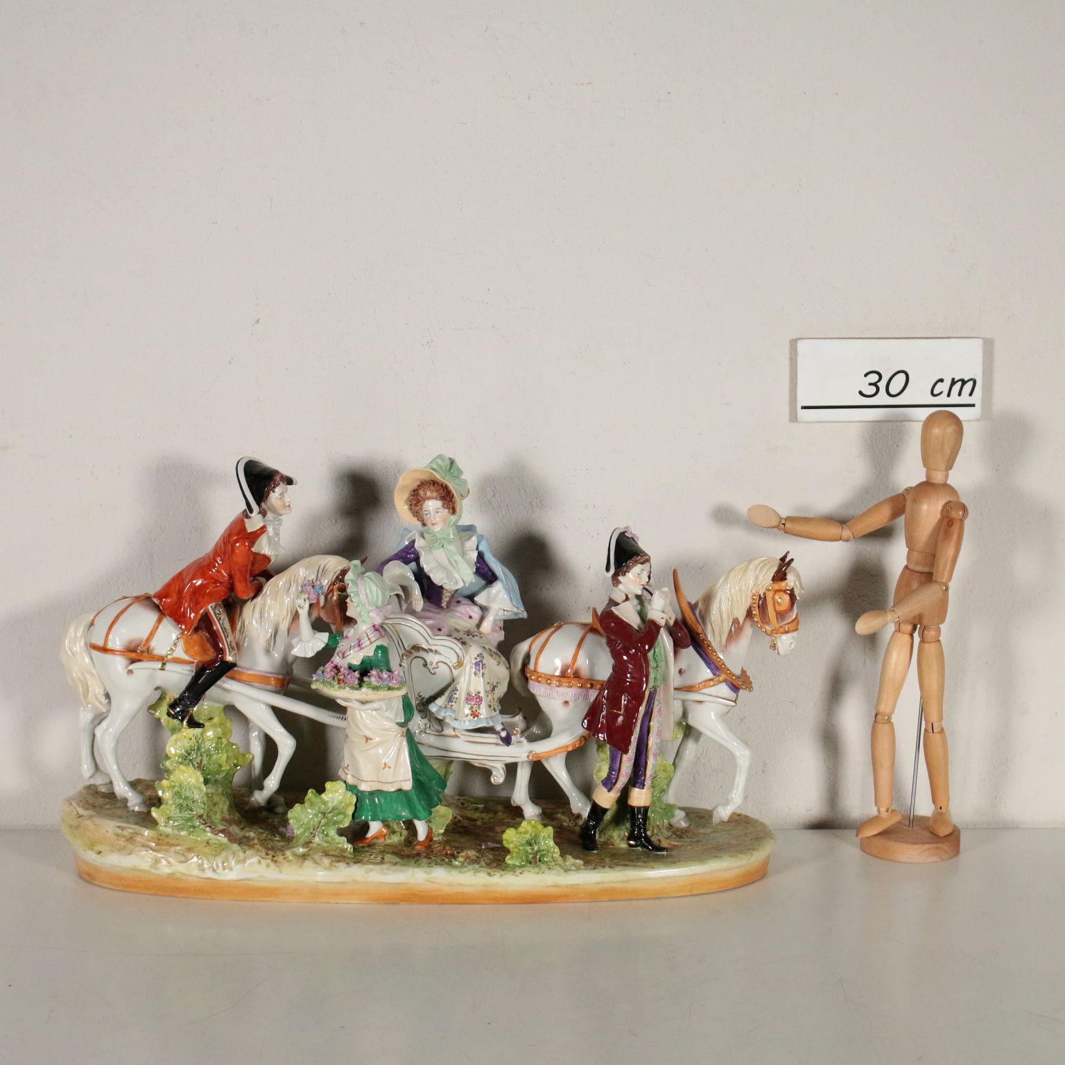 Porcelain ornament depicting court dames and men on horseback, polychrome refined ornaments. Brand of manufactured at the bottom. Manufactured in Italy, 20th century.