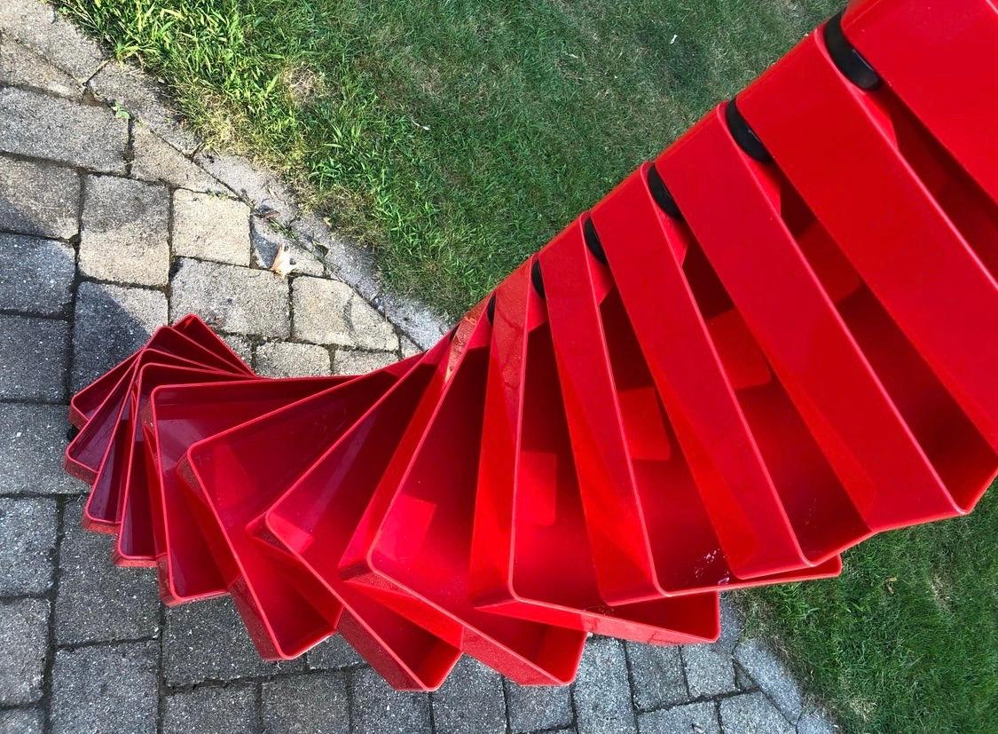 Architectural masterpiece is the Shiro Kuramata designed revolving cabinet made by Cappellini in the 1970s. The color is magnificent, red and the drawers all rotate. What a marvel! It looks like a modern sculpture and does have some age appropriate