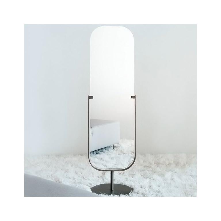 Mirror is free-standing and two-sided, with an adjustable tilt. Designed by Jasper Morrison, the base and frame are made of satined nickel.

Material: Metal and stratified mirror
Available finish: Satin nickel.