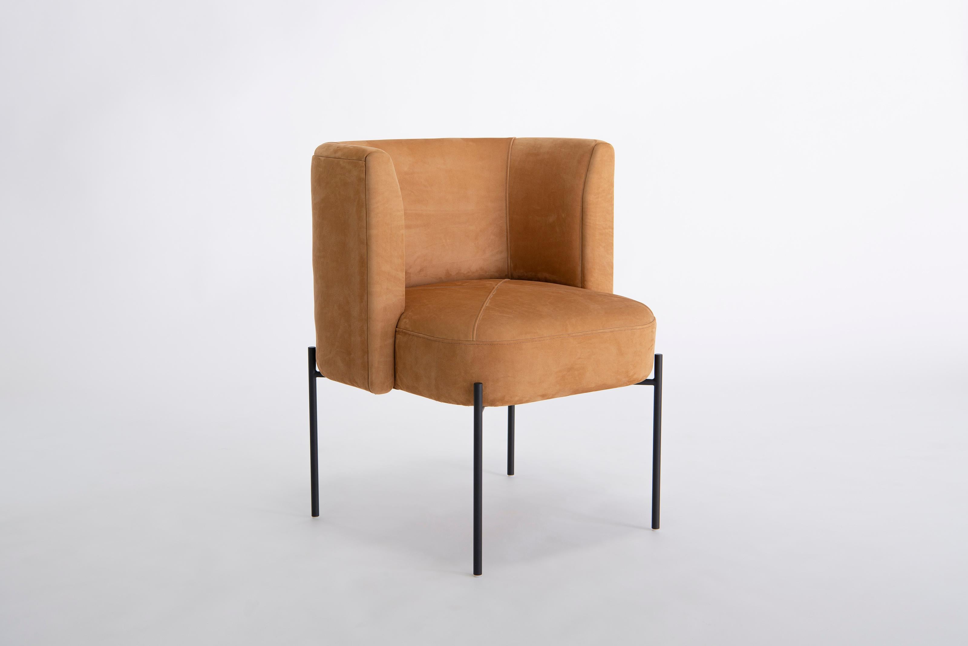 Capper Side Chair With Metal Base by Phase Design
Dimensions: D 56 x W 61 x H 76,2 cm. 
Materials: Upholstery, wood and powder-coated steel.

Wood construction with upholstered body. May be specified with or without a swivel base. Upholstery may be
