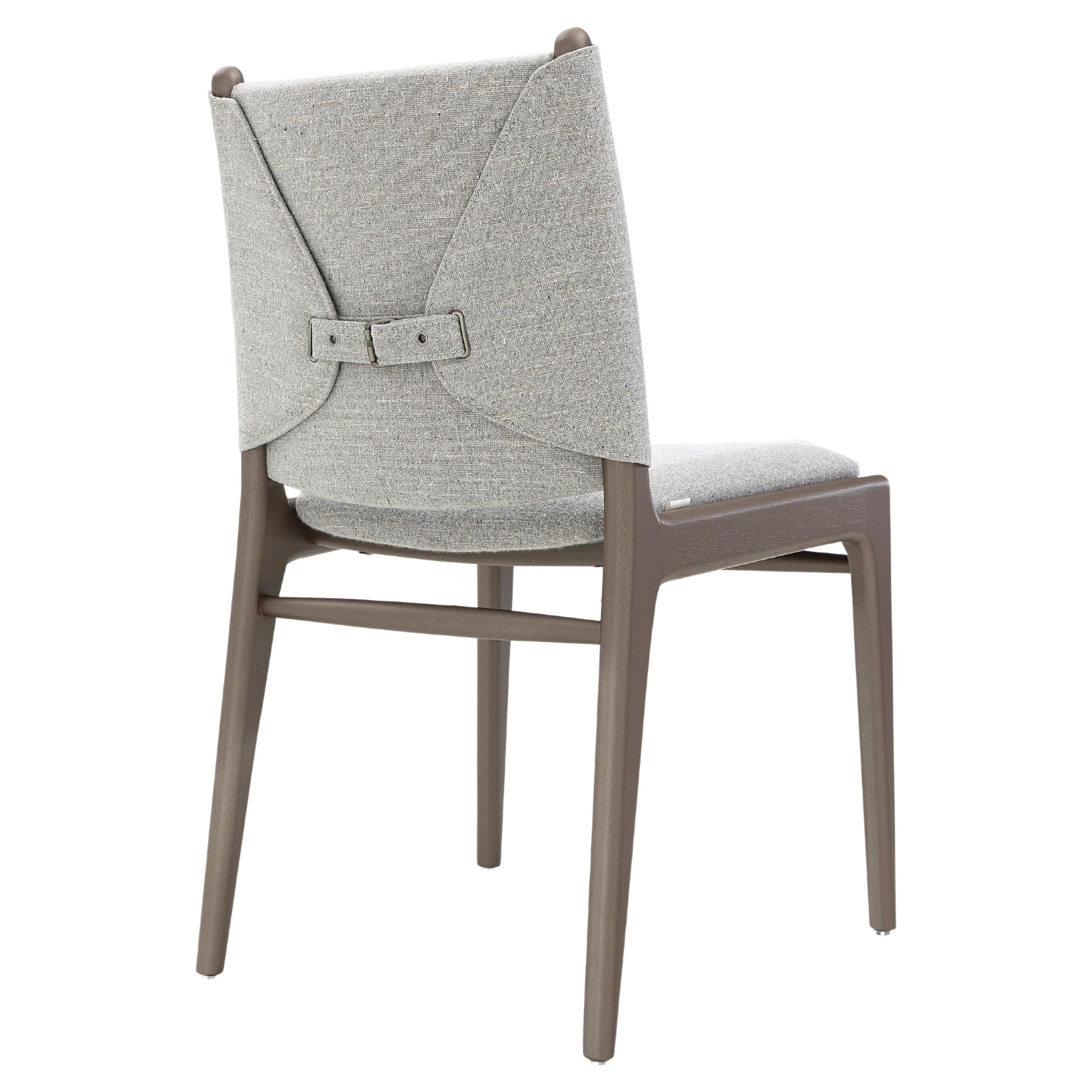 The Cappio chair highlights our beautiful chocolate wood color finish combined with a stunning gray fabric, this chair features a unique buckle design on the back of the seat. Our team at Uultis has designed this simple but elegant design that will