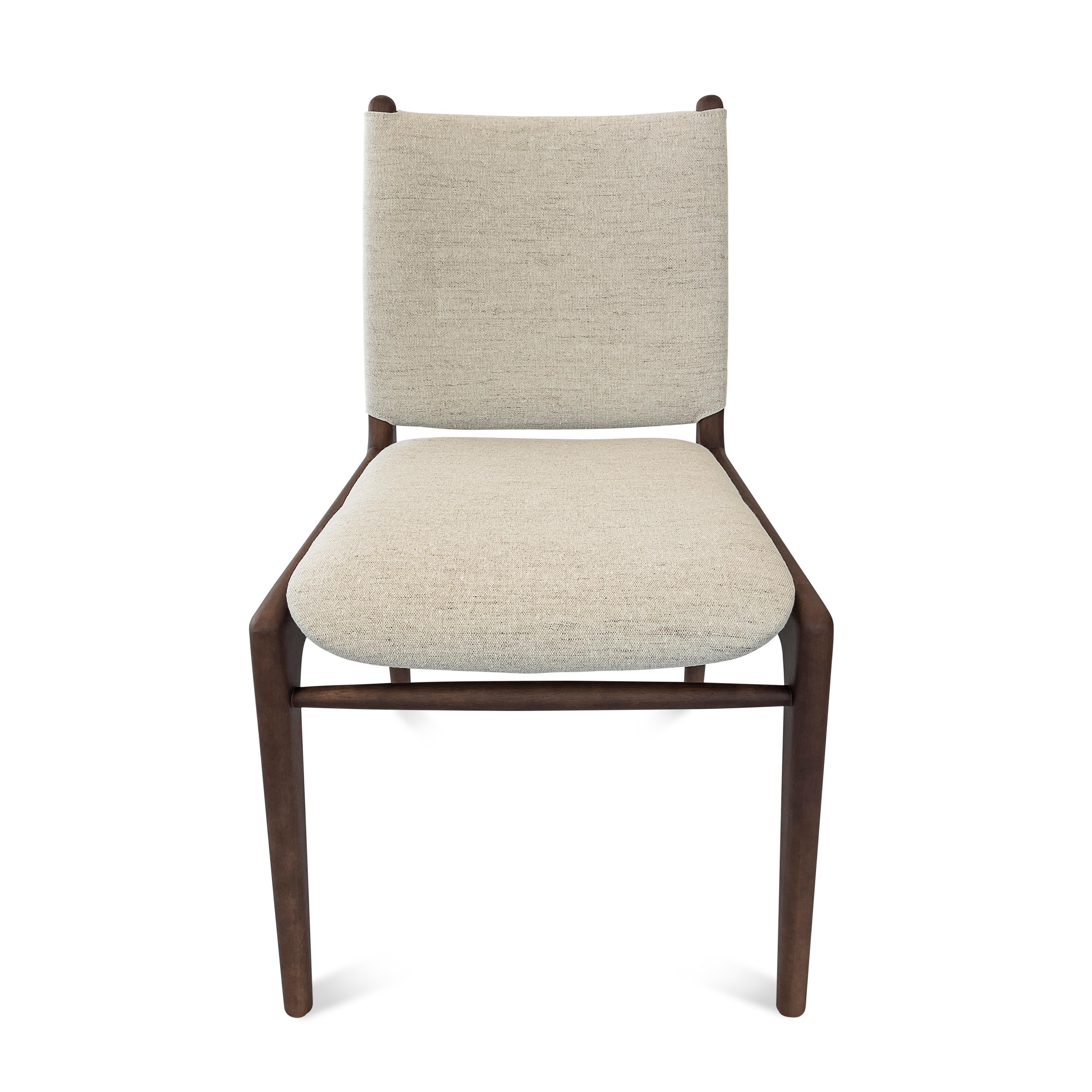 The Cappio chair highlights our beautiful walnut wood finish combined with a stunning beige fabric, this chair features a unique buckle design on the back of the seat. Our team at Uultis has designed this simple but elegant design that will
