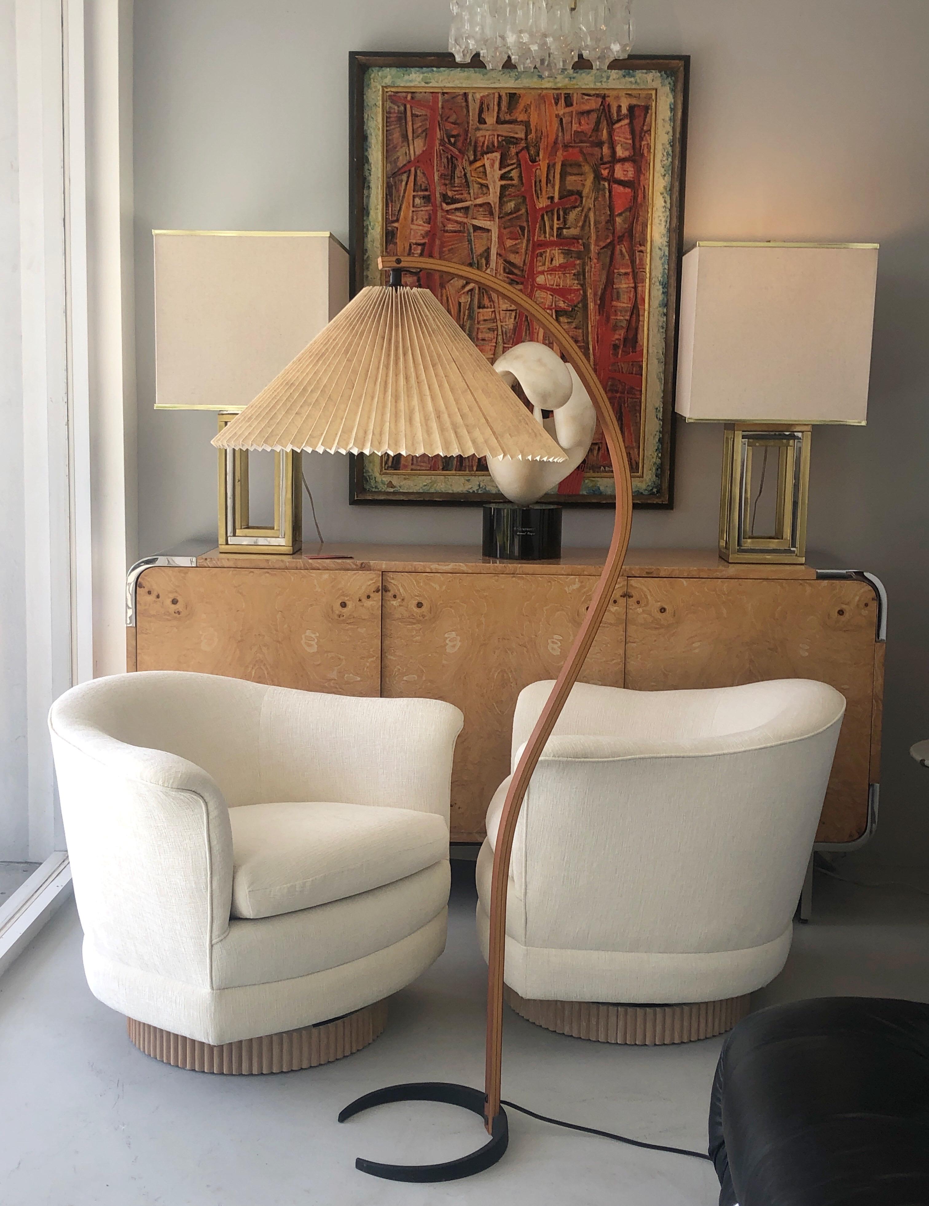 Stylish floor lamp by Mads Caprani Light. Signed on the solid iron crescent shape base. Retains the original pleaded shade.