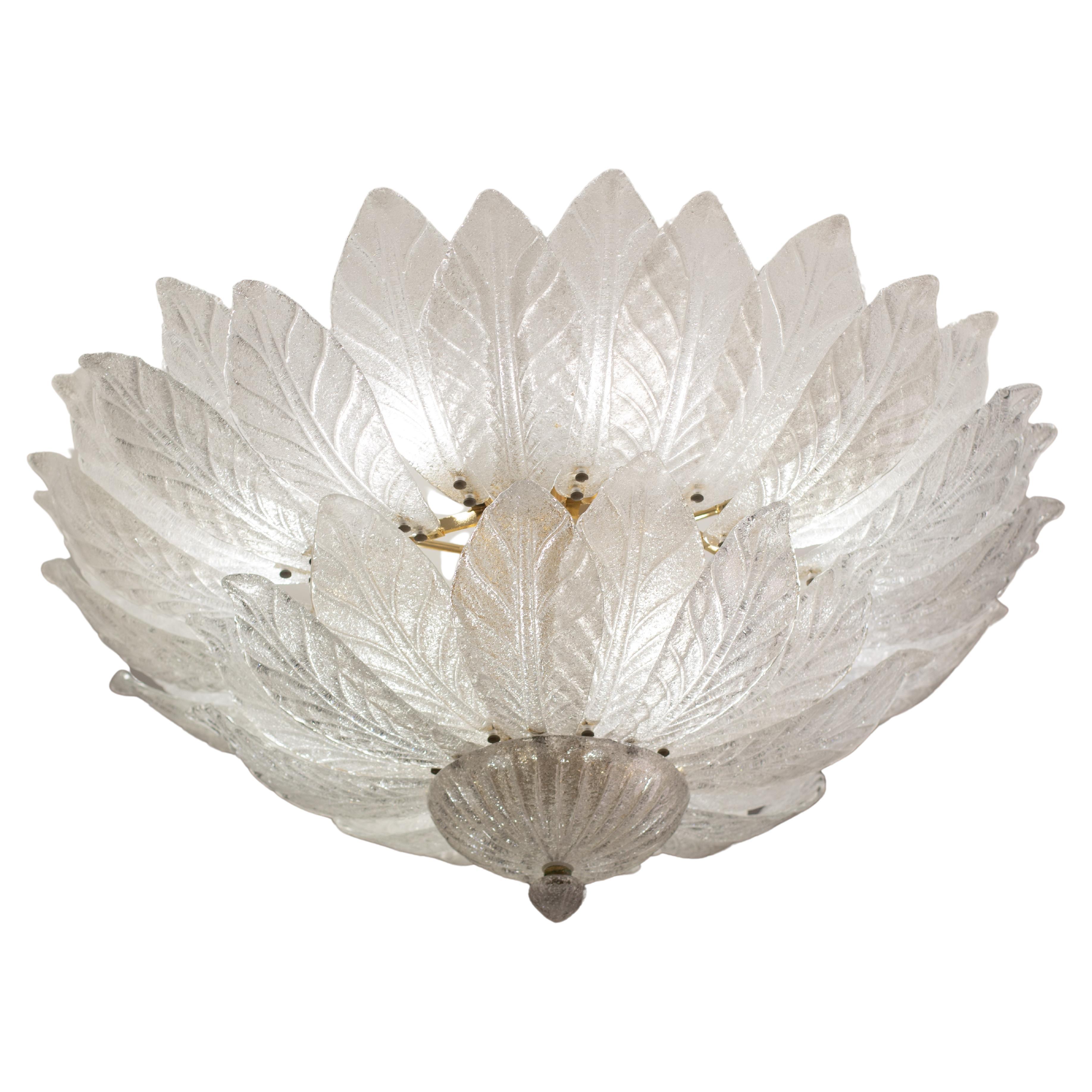Large and elegant built-in Murano glass chandelier in neoclassical style, Italy, circa 1970s.
The Murano chandelier, in the Mid-Century Modern style, is composed of two layers of transparent leaf glass and a gold frame.
The two layers are divided