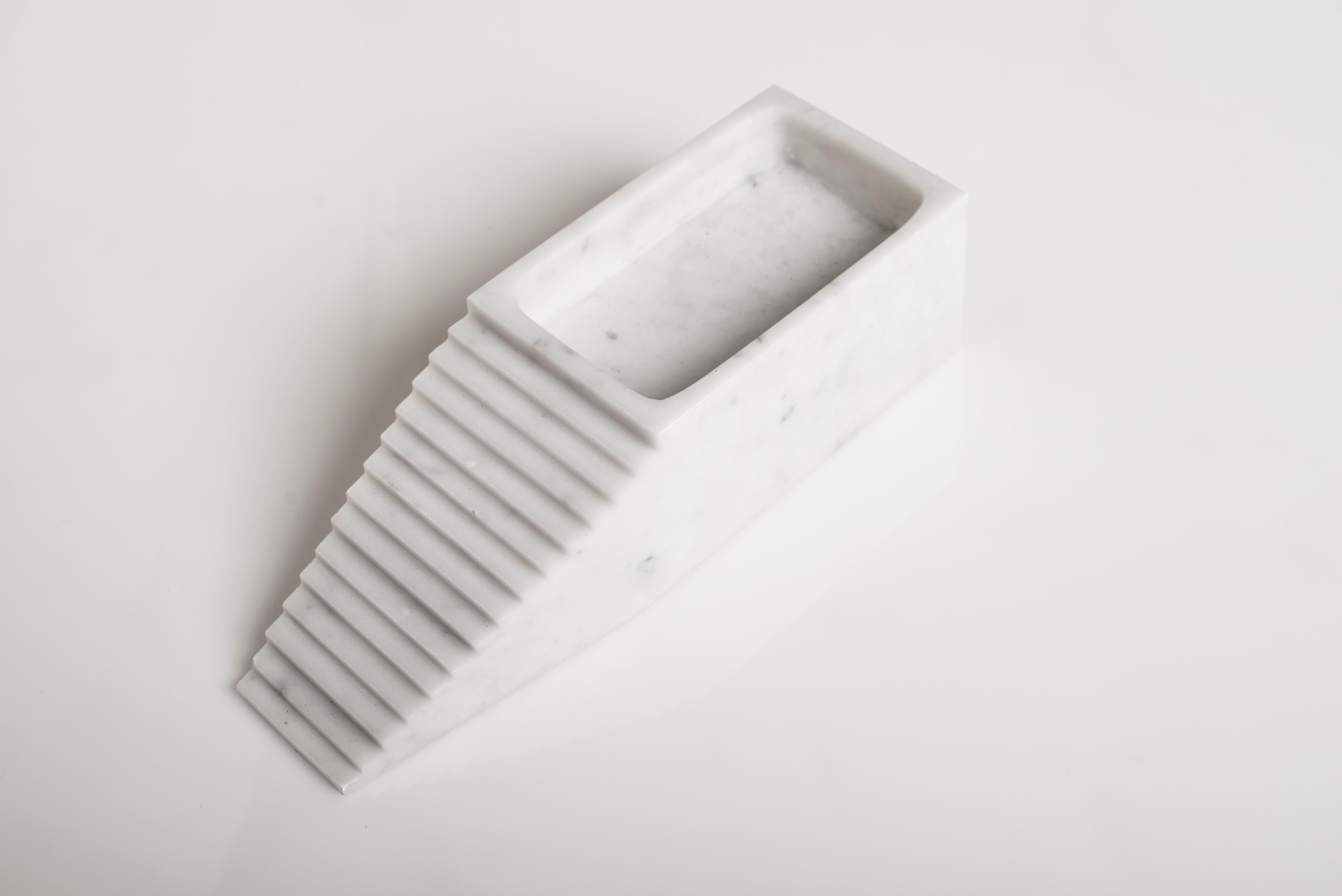 Capri sculpture by Carlo Massoud
Handmade 
Dimensions: D 30 x W 10 x H 7 cm 
Materials: carrara marble

Carlo Massoud’s work stems from his relentless questioning of social, political, cultural, and environmental norms. He often pushes his