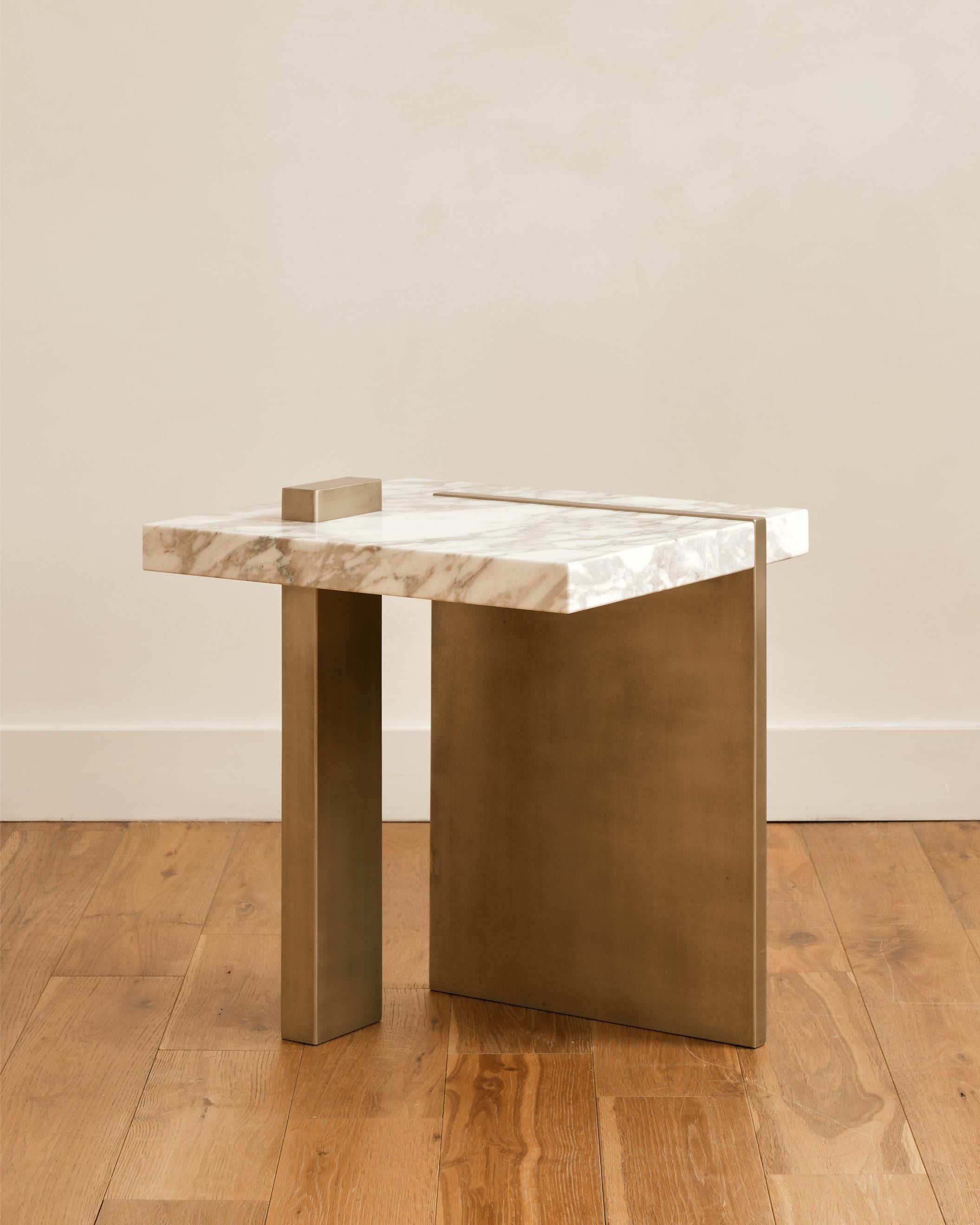 Capri Side Table by Studio Sam London
Dimensions: W 40 x D 45 x H 45 cm
Materials: Arabescato Oro Marble and Liquid Metal

The Capri side table is inspired by the rocks of Capri, represented by the solid marble slab that meet the sea on a early