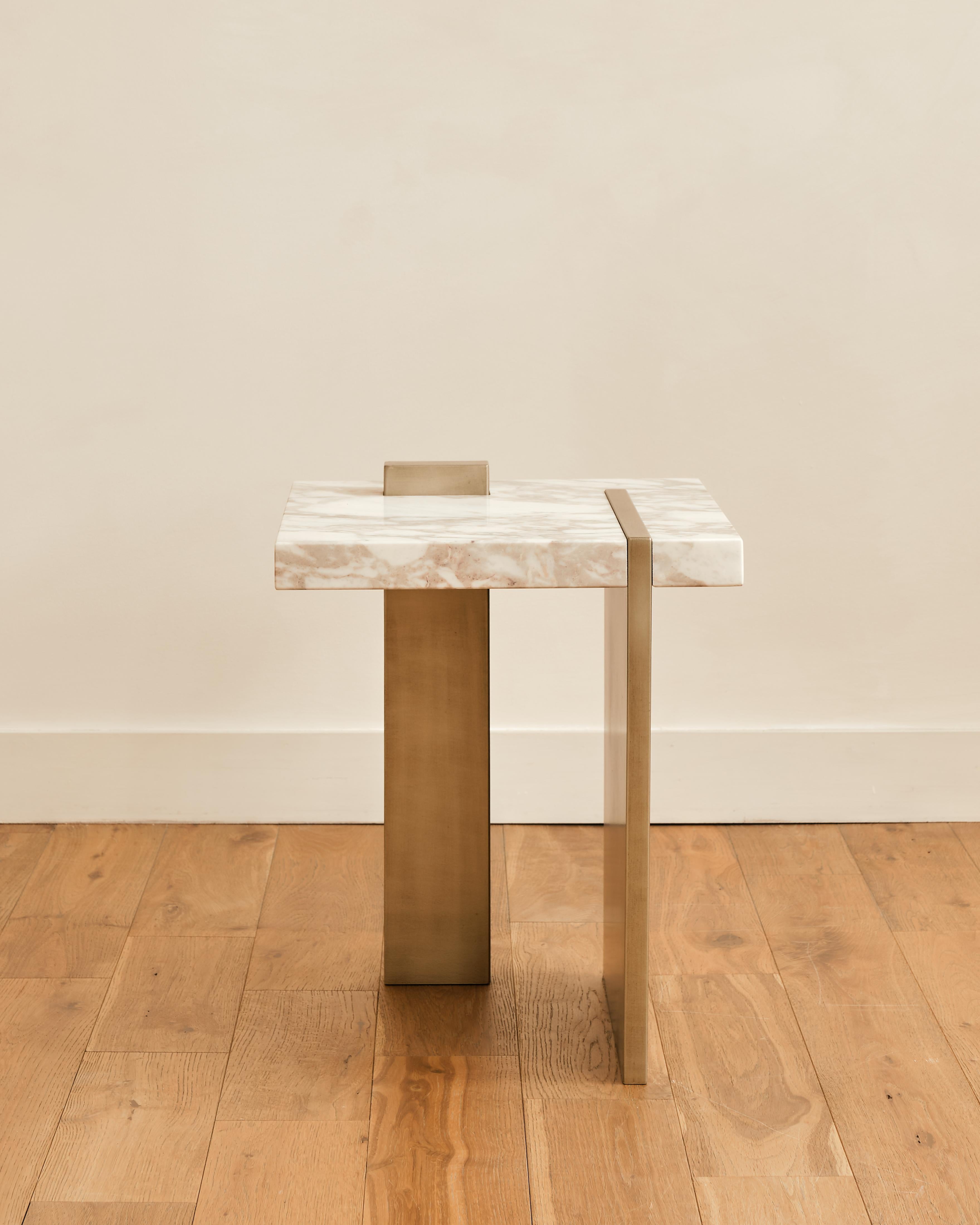 The Capri side table by Studio Sam London is inspired by the rocks of Capri, represented by the solid marble slab that meet the sea on an early morning sunrise, represented by the application of the liquid metal in the base and top detail.
The