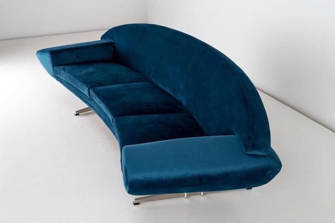 The Capri Sofa by Danish designer Johannes Andersen a gorgeous mid-century modern statement piece. Upholstered in a rich turquoise  blue velvet, its curved silhouette and elevated backrest reflect the designer's signature elegance and craftsmanship.