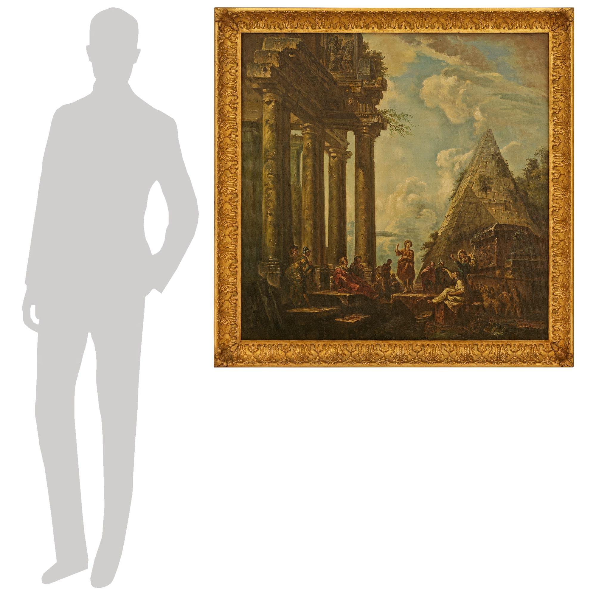 Ein elegantes und äußerst dekoratives italienisches Capriccio st. des 19. Öl auf Leinwand Gemälde des Tempels des Saturn und der Pyramide des Cestius. Dieses atemberaubende Schulgemälde ist in einen wunderschönen Rahmen aus Giltwood mit Palmetten an