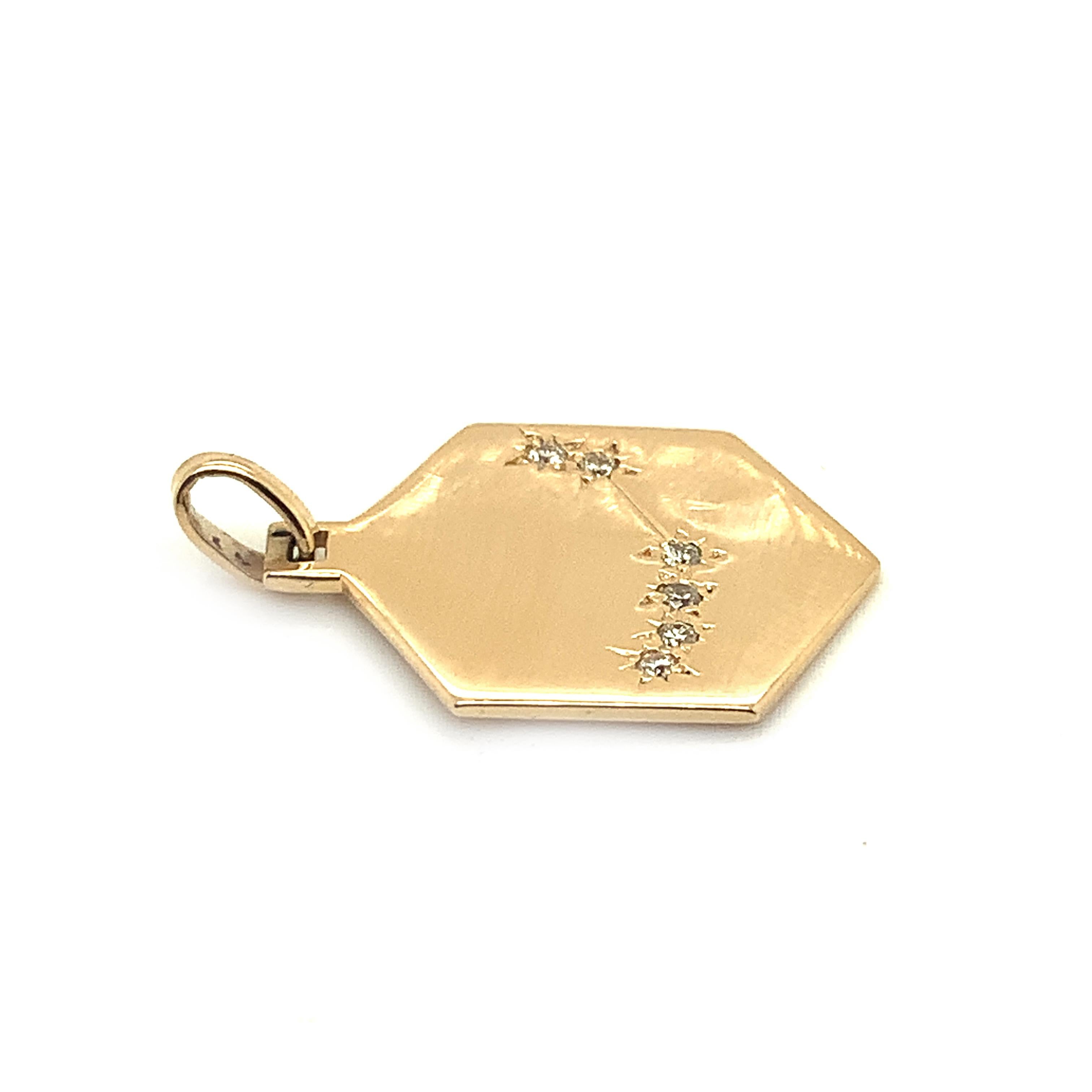 Striking six-sided 14K yellow gold Charm/Pendant.  Six faceted diamonds in a starburst pattern portray the zodiac 