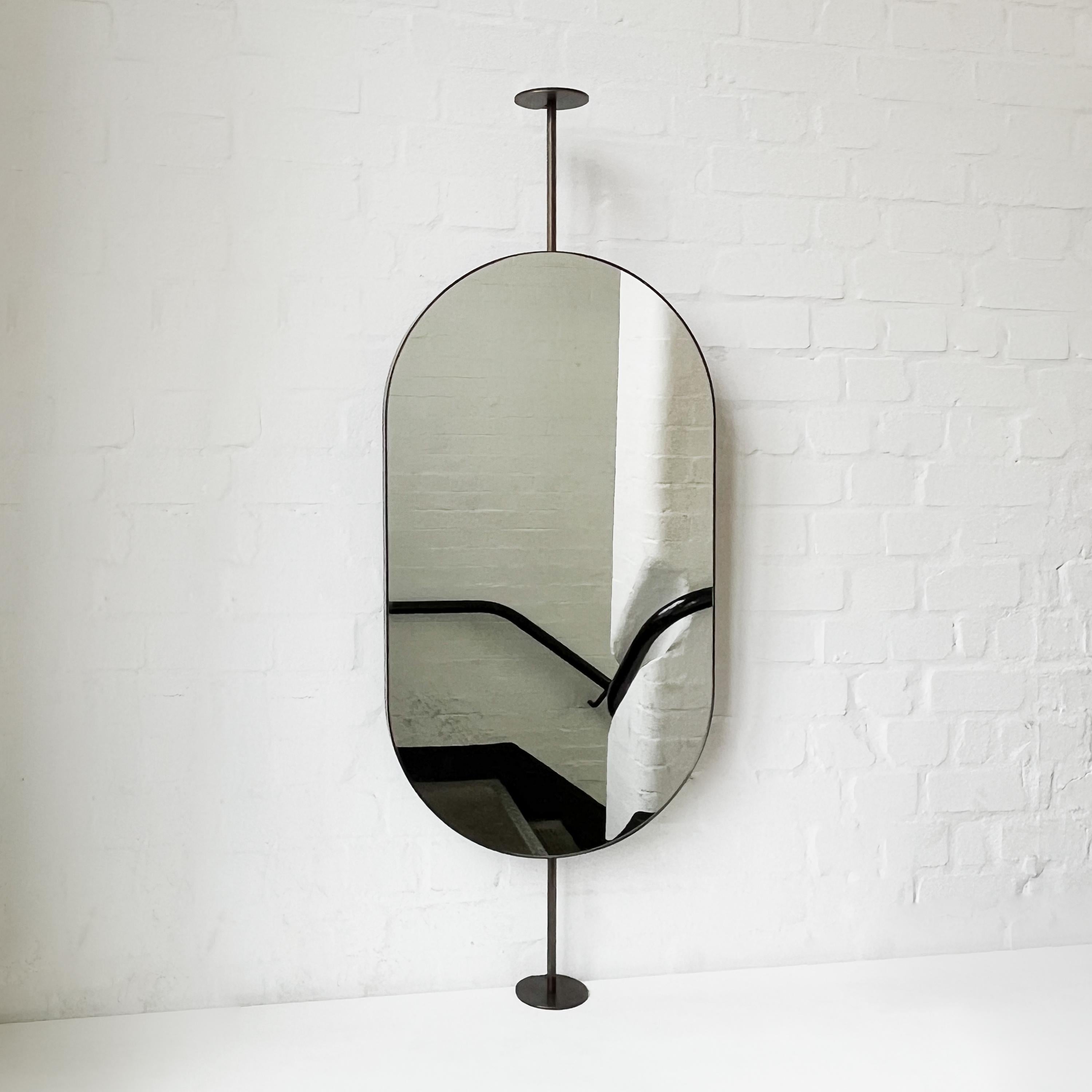 Brass Capsula Countertop to Ceiling Attached Pill shaped Mirror, Bronze Patina Frame For Sale