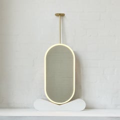Capsula Front Illuminated Ceiling Suspended Modern Mirror with a Brass Frame