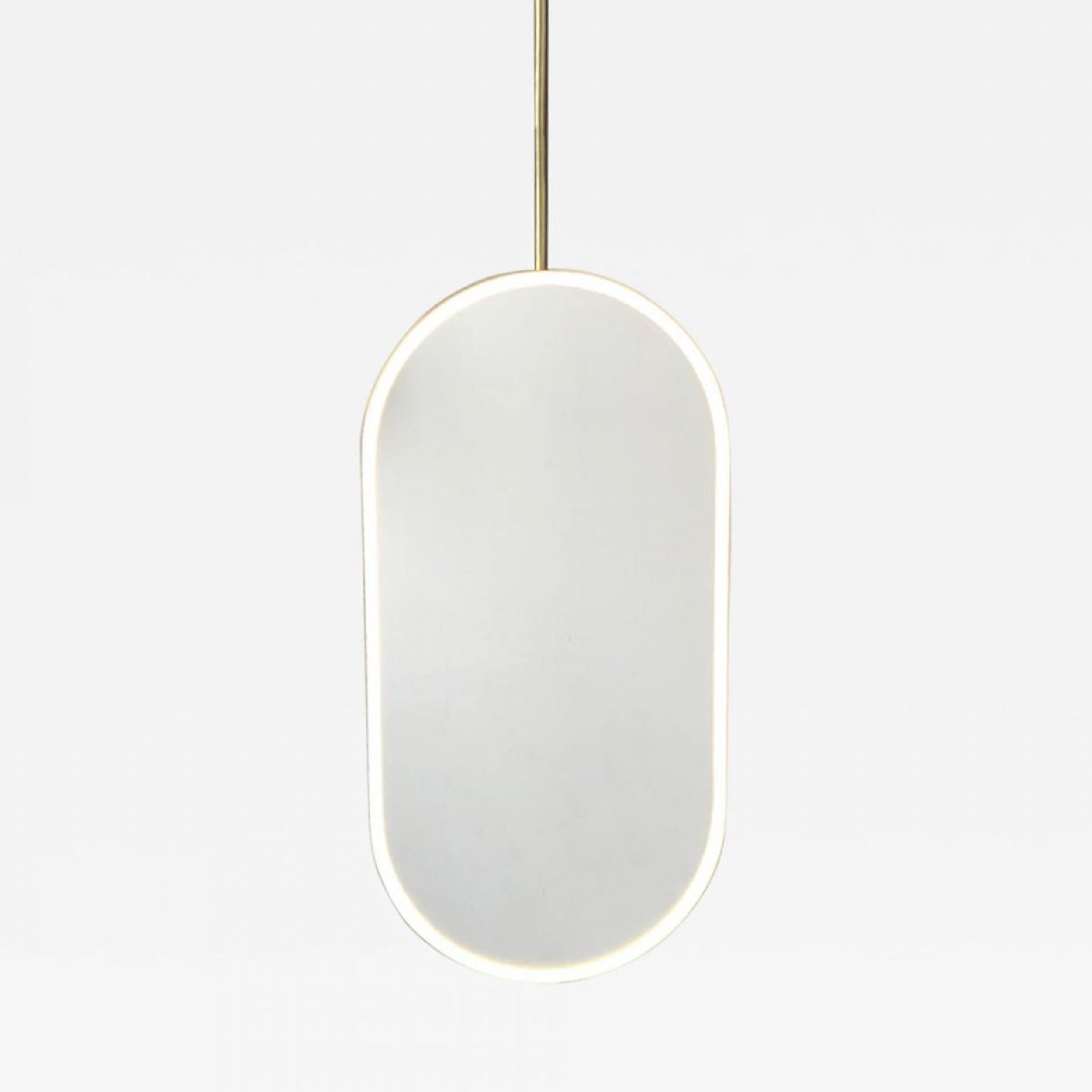 Modern front illuminated Capsula™ ceiling suspended pill shaped mirror with a minimalist brushed brass frame, arm and white powder coated panel backing (customisable).

Our unique collections of ceiling suspended mirrors are designed and handcrafted