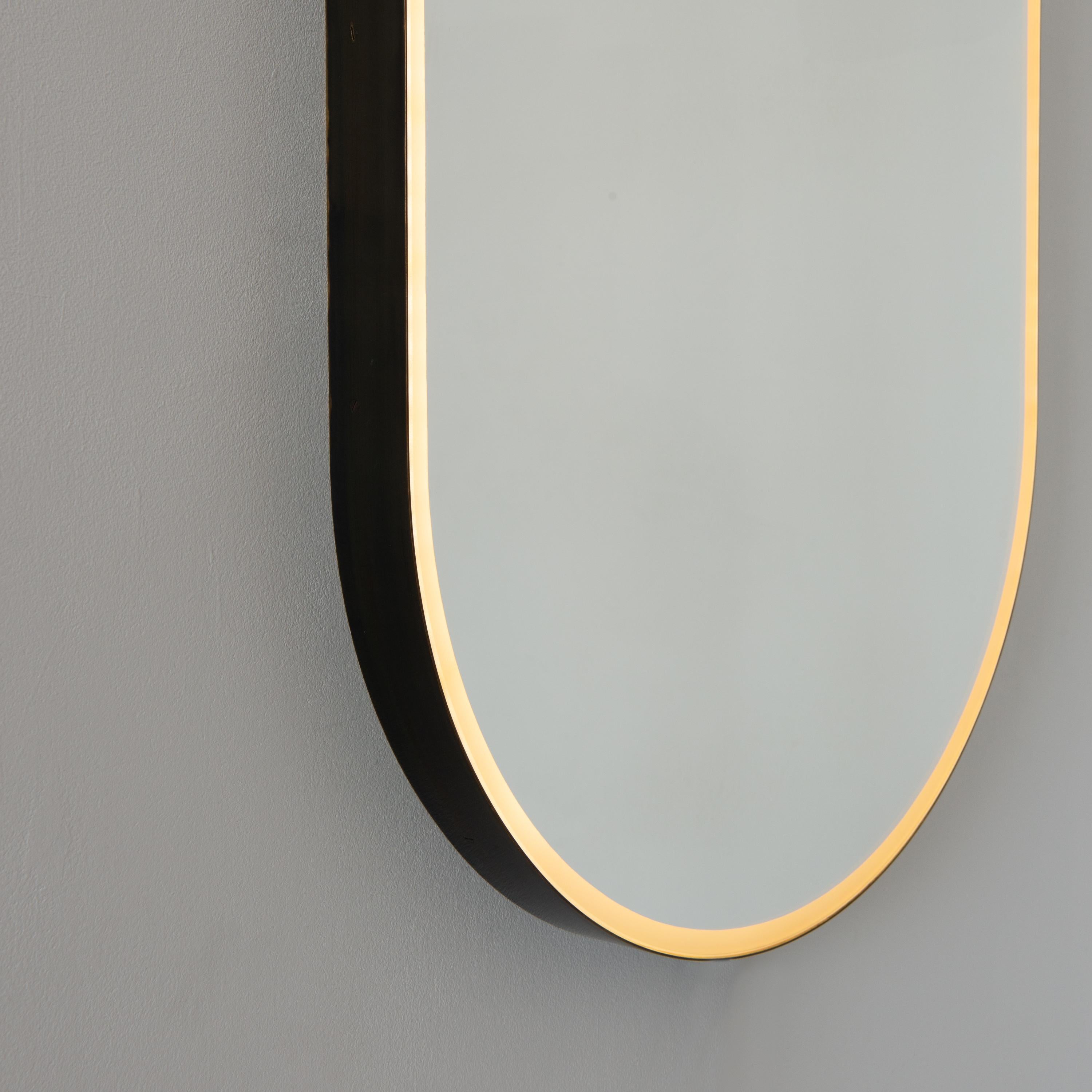 Contemporary Capsula Illuminated Pill Shaped Mirror with Bronze Patina Frame, Medium For Sale