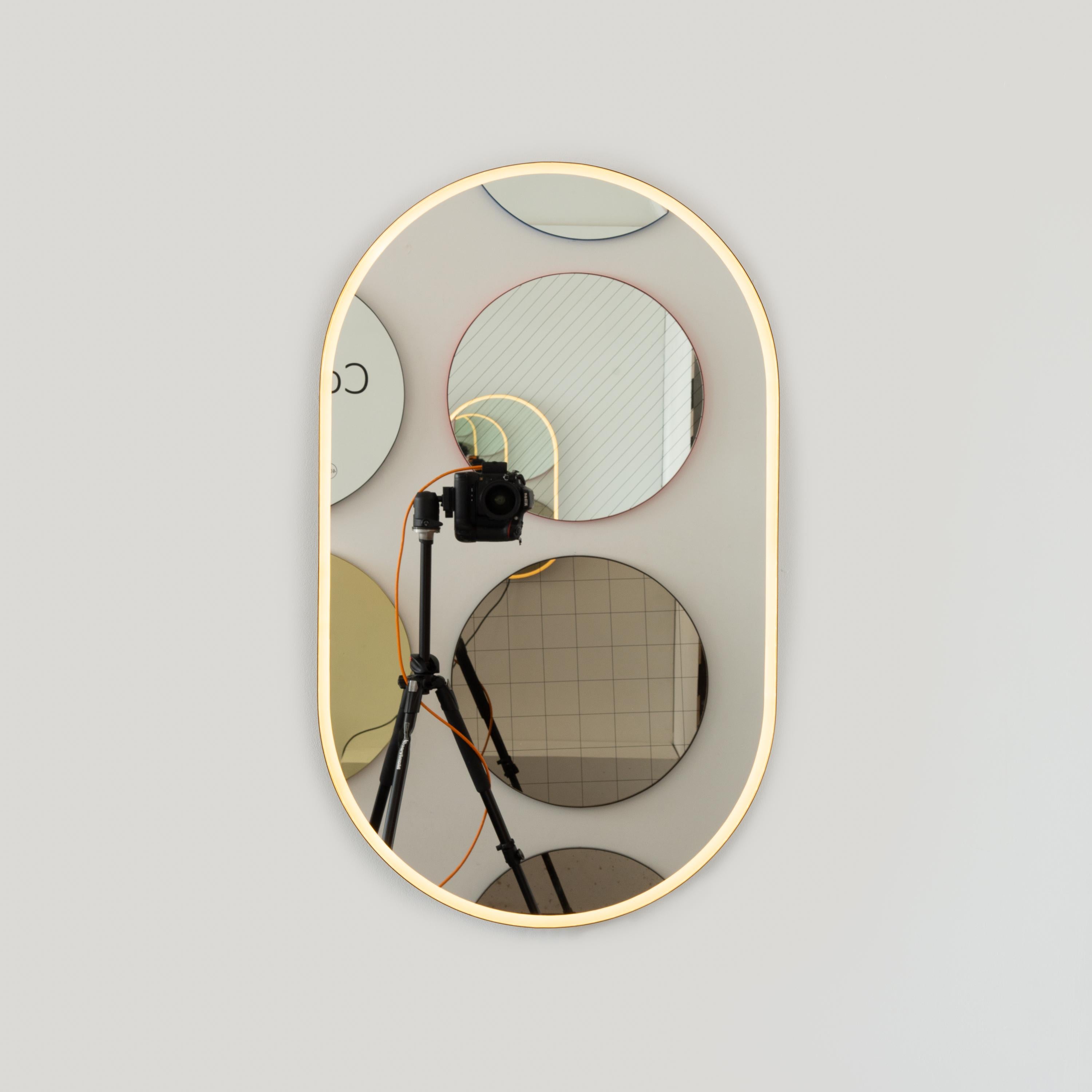 Brass Capsula Illuminated Pill Shaped Mirror with Bronze Patina Frame, Medium For Sale