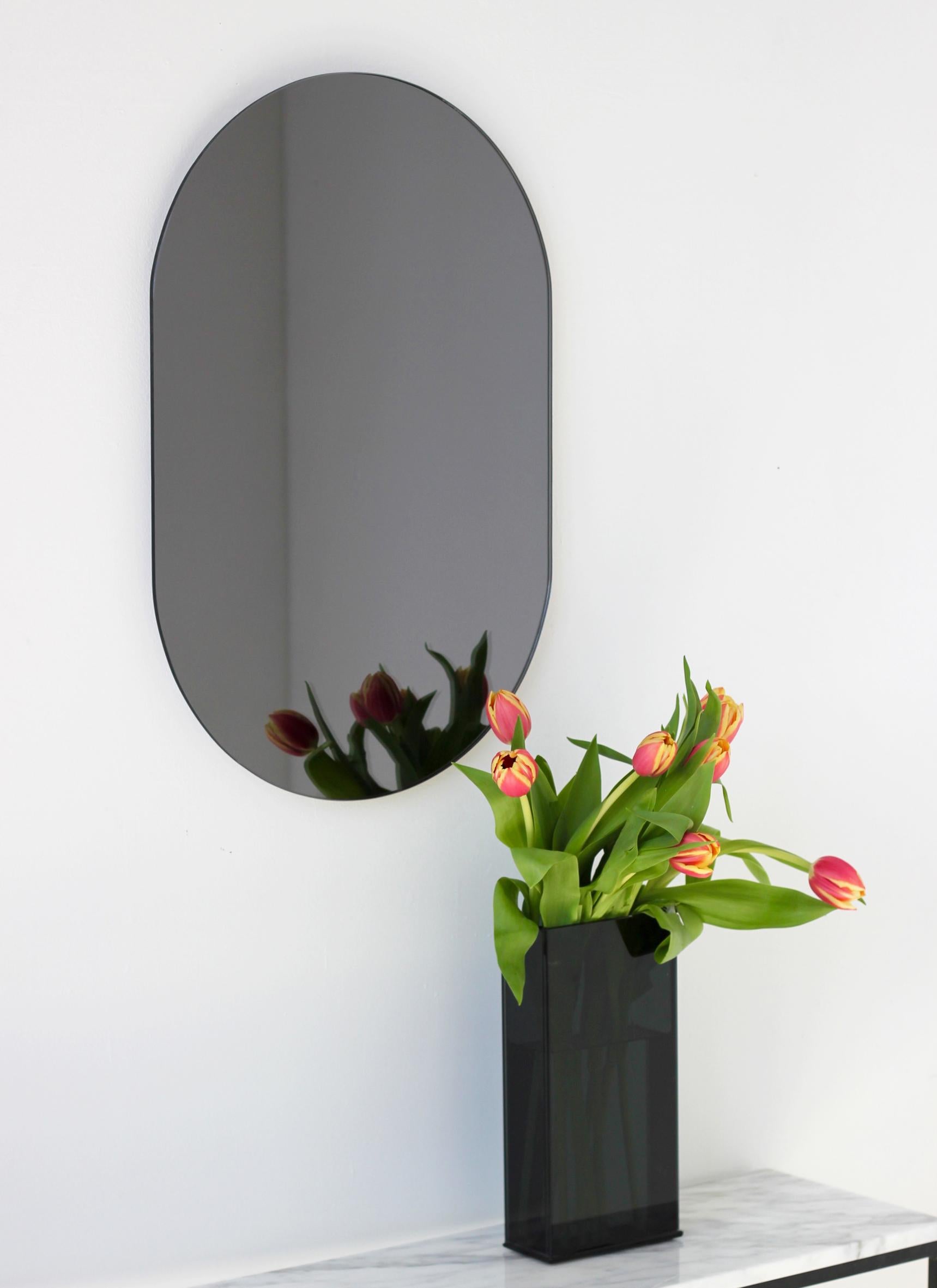 British Capsula Capsule shaped Black Tinted Minimalist Frameless Mirror, Large For Sale