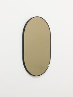 Capsula Capsule shaped Bronze Modern Mirror with Black Frame, Medium