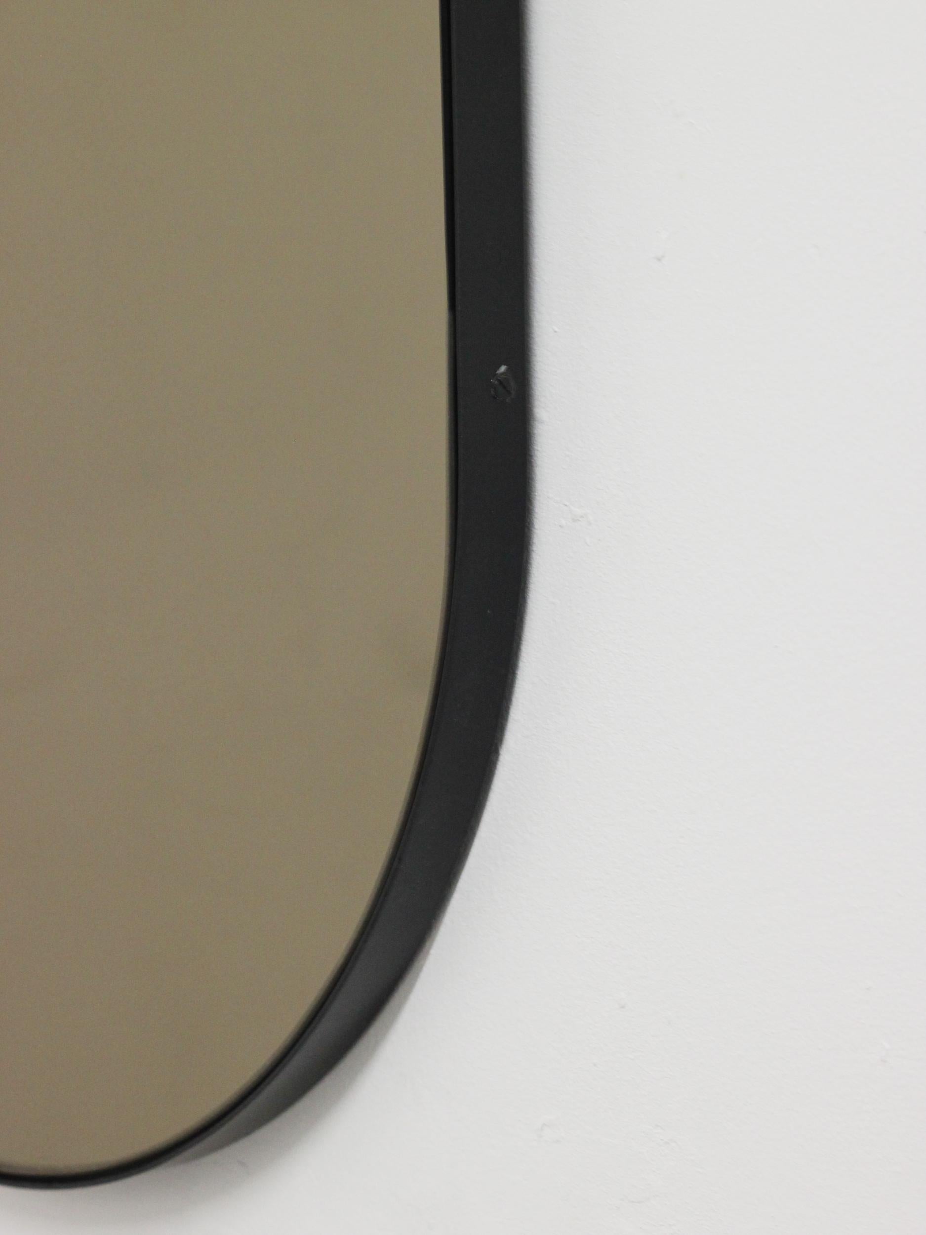 Aluminum Capsula Capsule shaped Bronze Contemporary Mirror with Black Frame, Large For Sale