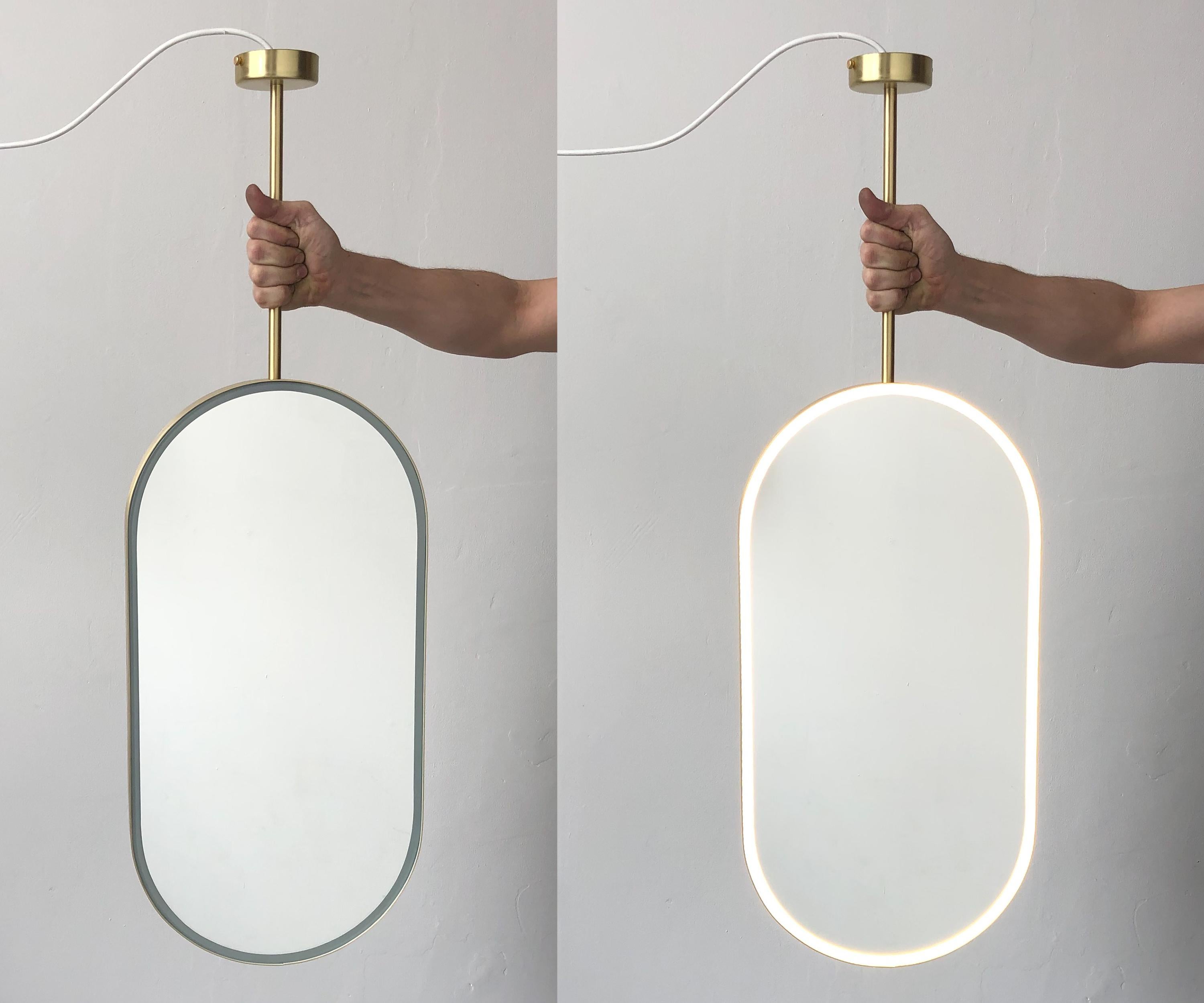 Modern Capsula Front Illuminated Ceiling Suspended Pendant Mirror with a Brass Frame For Sale