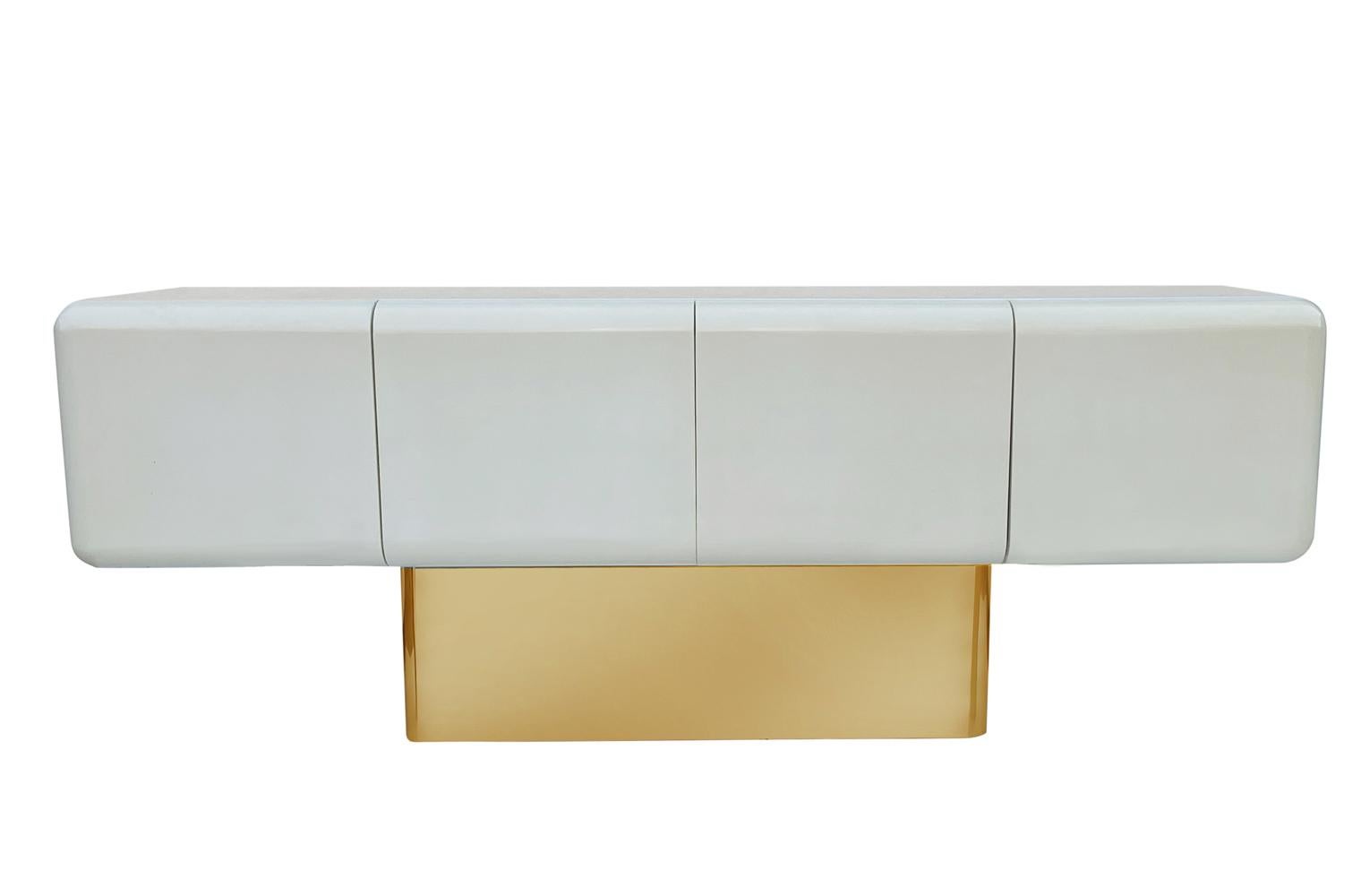 Capsule Form Mid-Century Modern off White Credenza or Sideboard on Brass Base  In Good Condition In Philadelphia, PA