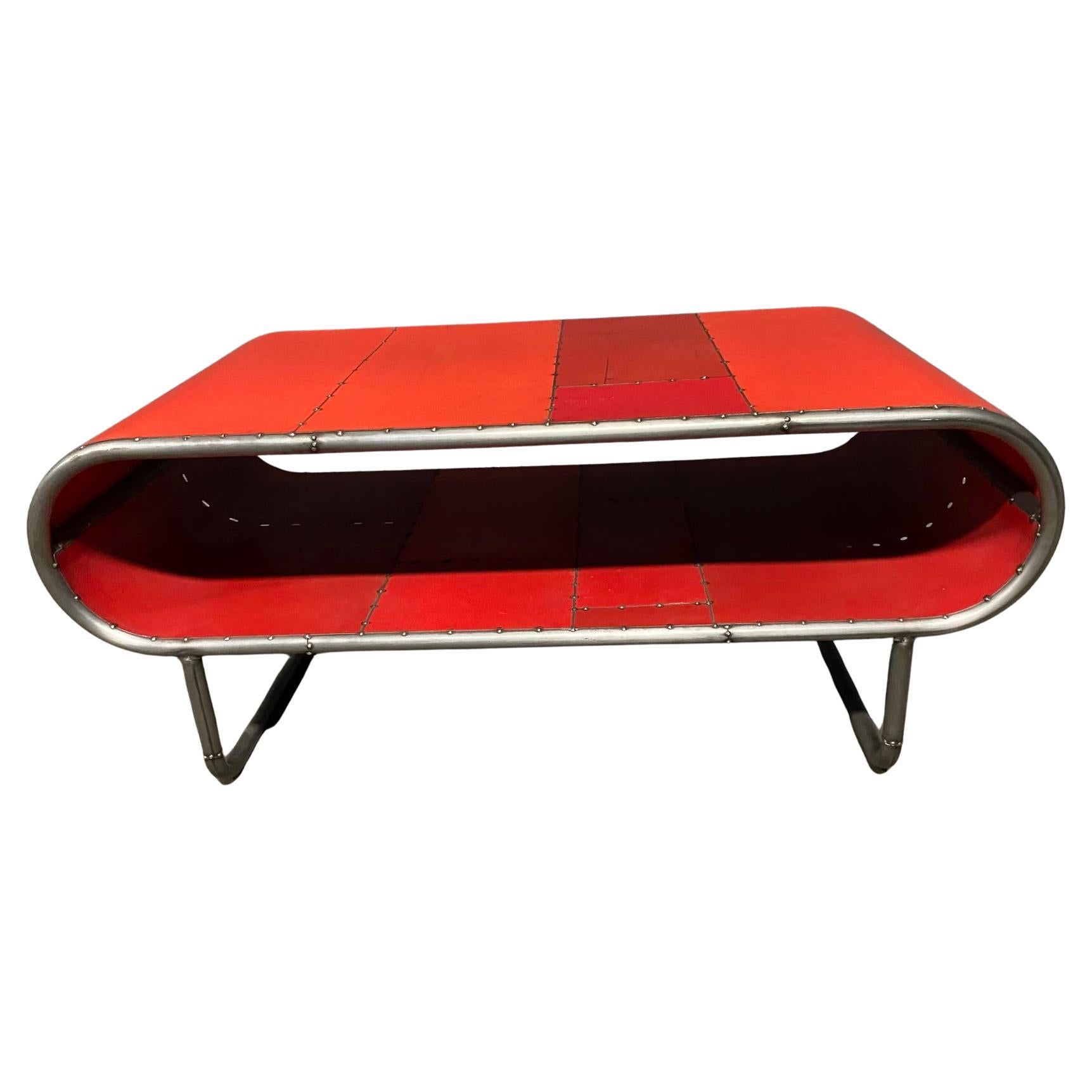Capsule Shaped Cocktail table made from bent steel tubing and reclaimed metal