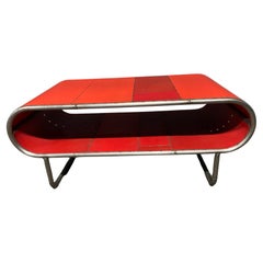 Capsule Shaped Cocktail table made from bent steel tubing and reclaimed metal
