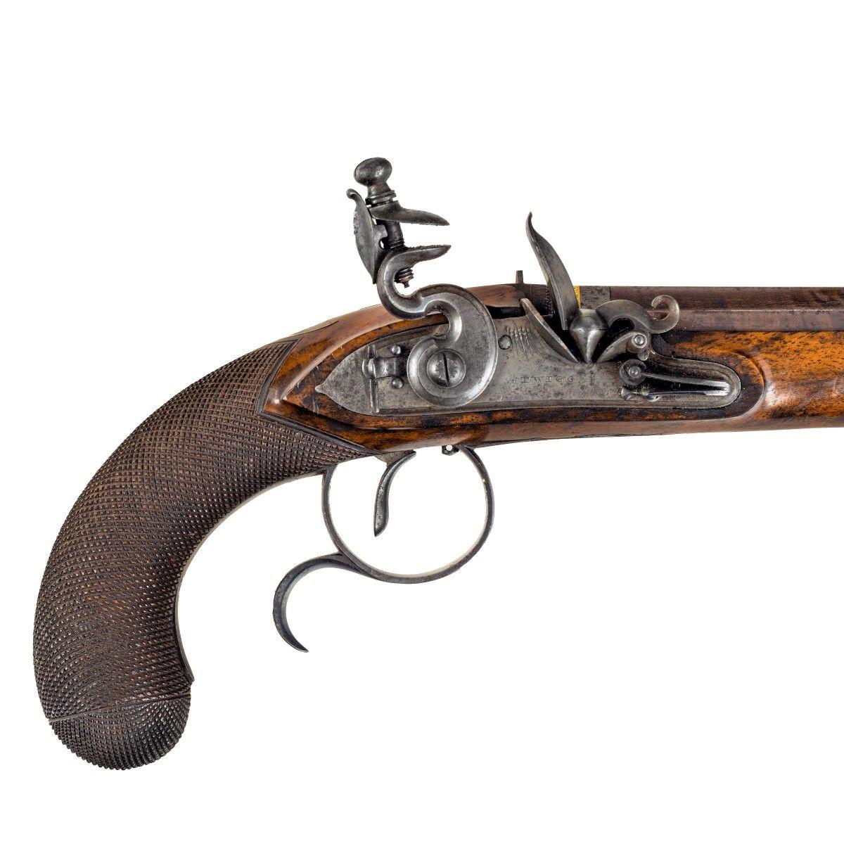 A pair of flintlock duelling pistols by Twigg of London, with octagonal barrels inlaid with gold, walnut stocks and chequered butts. All in the original fitted mahogany case with a steel bullet mould, oil can and cleaning rod. The cover is mounted