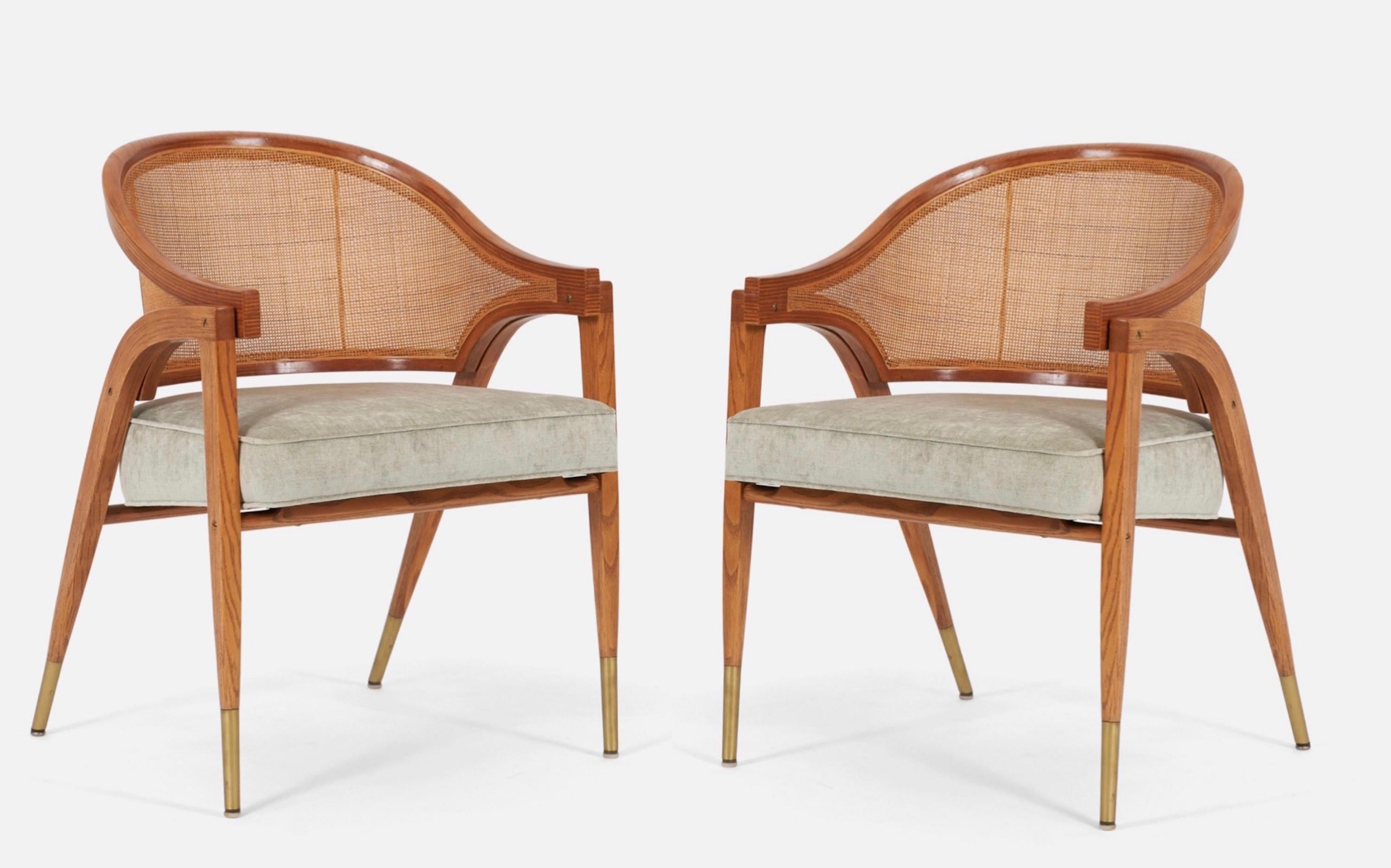 Pair of armchairs designed by Edward Wormley for Dunbar. Sculptural form wood frames with cane backs and brass details.